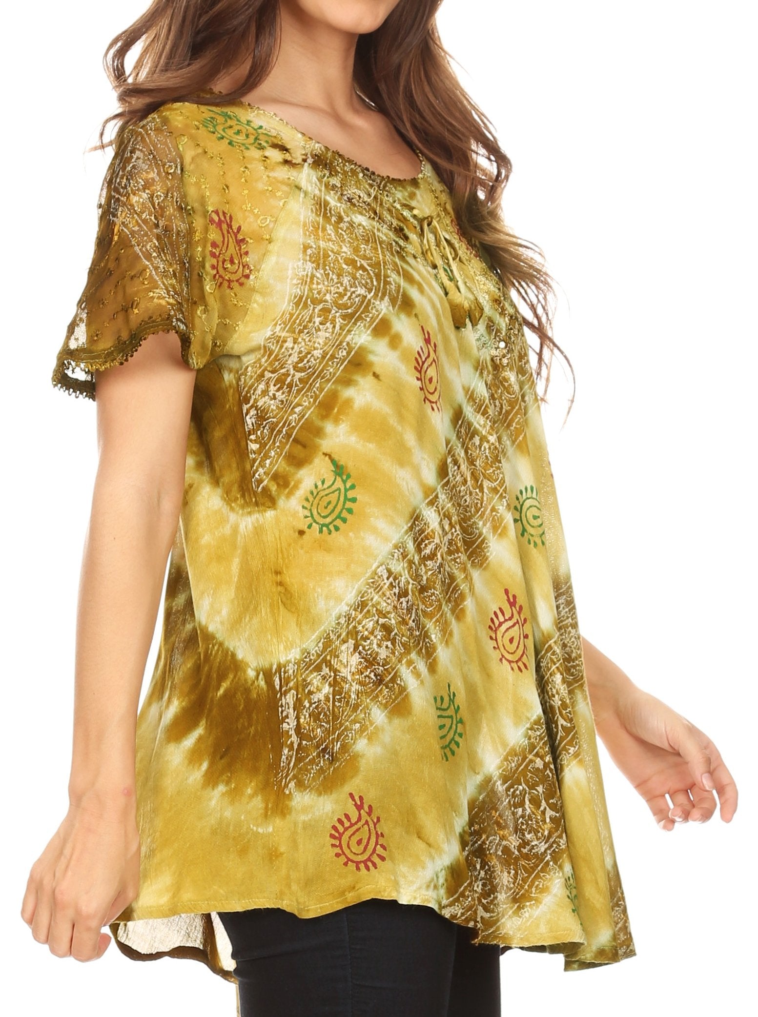 Woman wearing a yellow tie-dye shirt with patterns on a white background