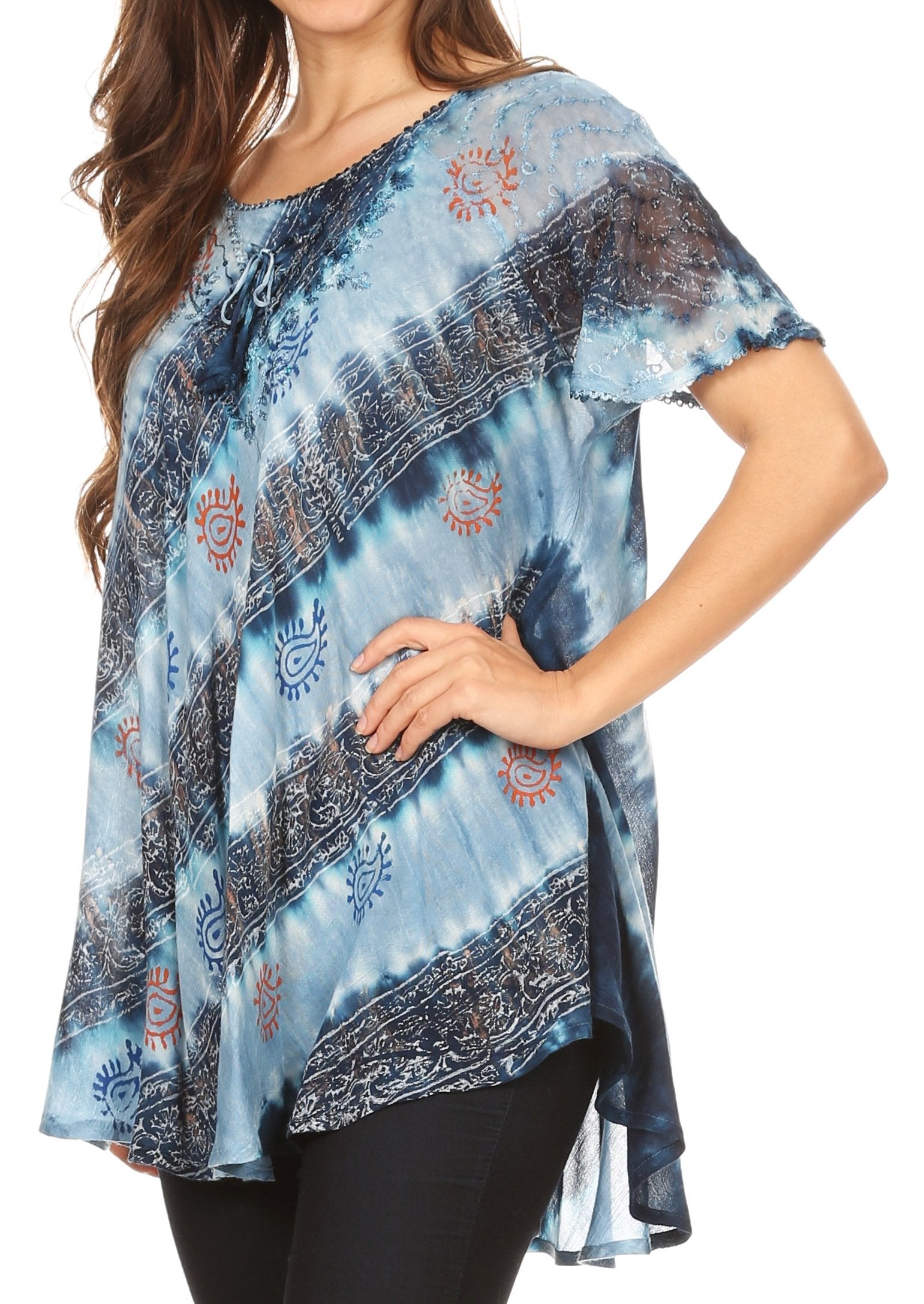 Woman wearing a blue tie-dye top with patterns on a white background