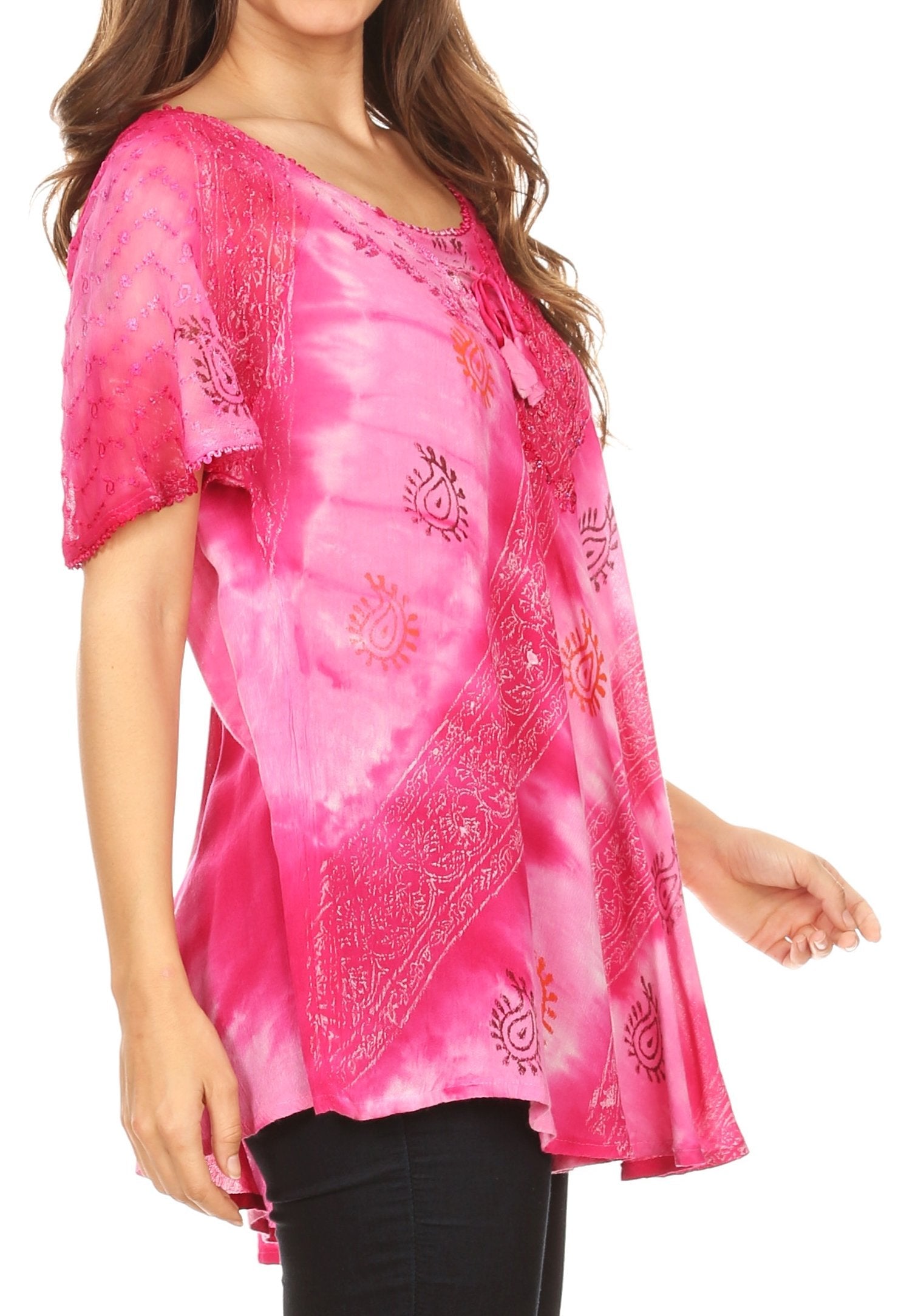 Woman wearing a pink tie-dye blouse with patterns on a white background