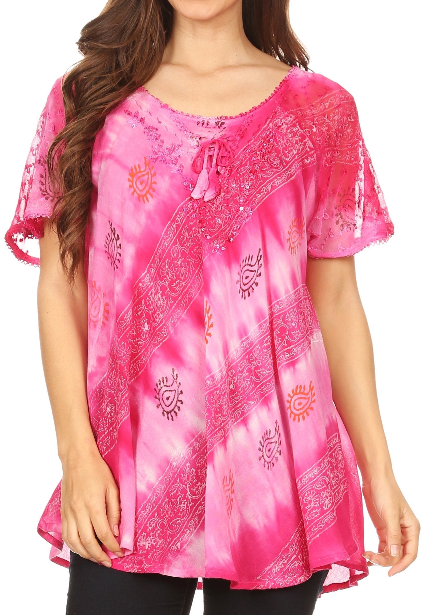 Pink embroidered top worn by a model on a white background
