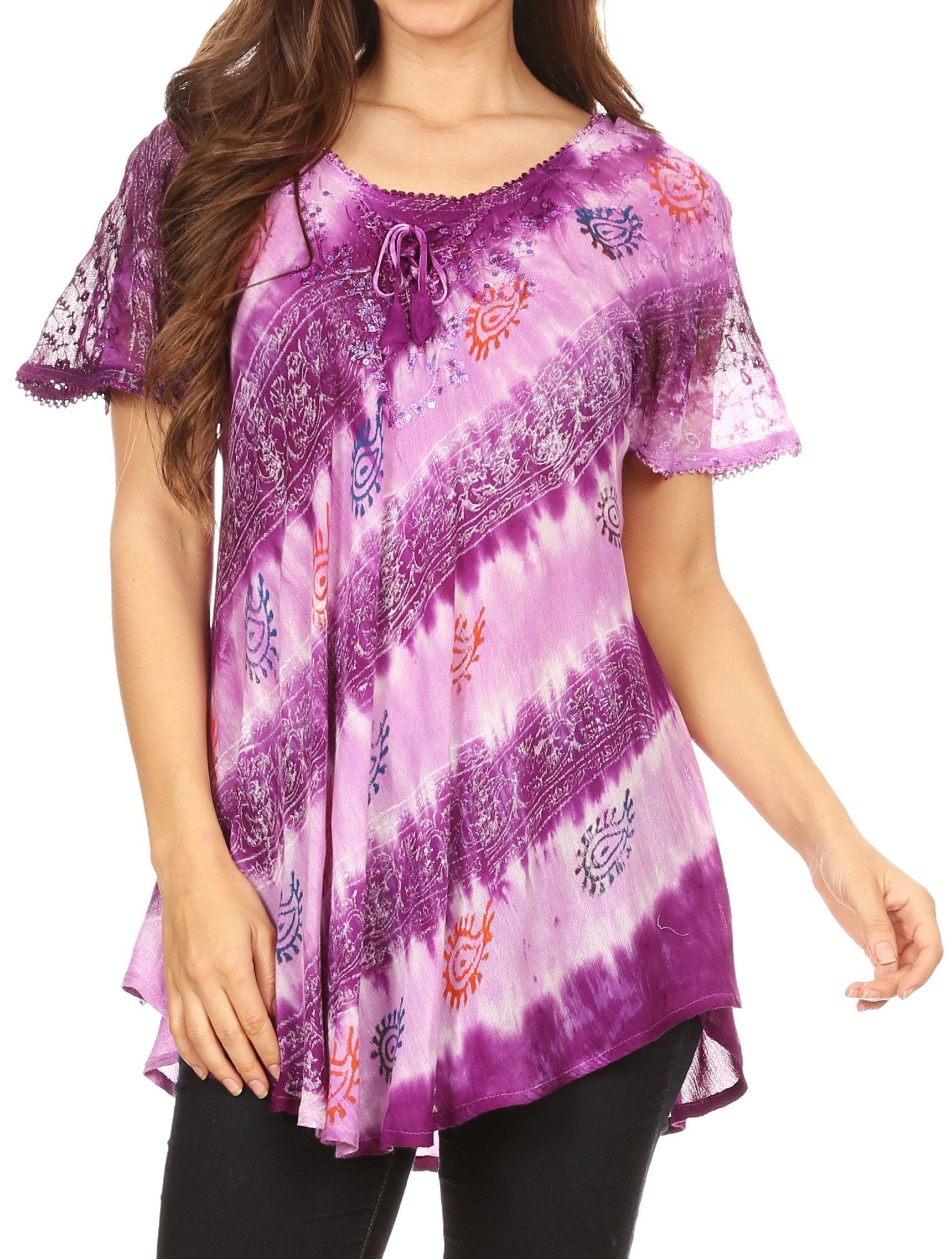 Woman wearing a purple patterned top on a white background