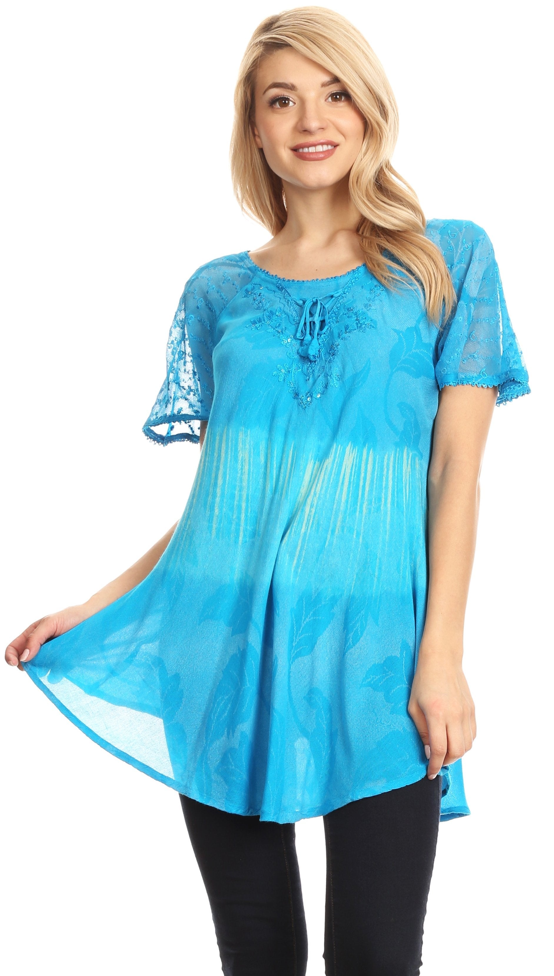 Woman wearing a blue lace top on a white background