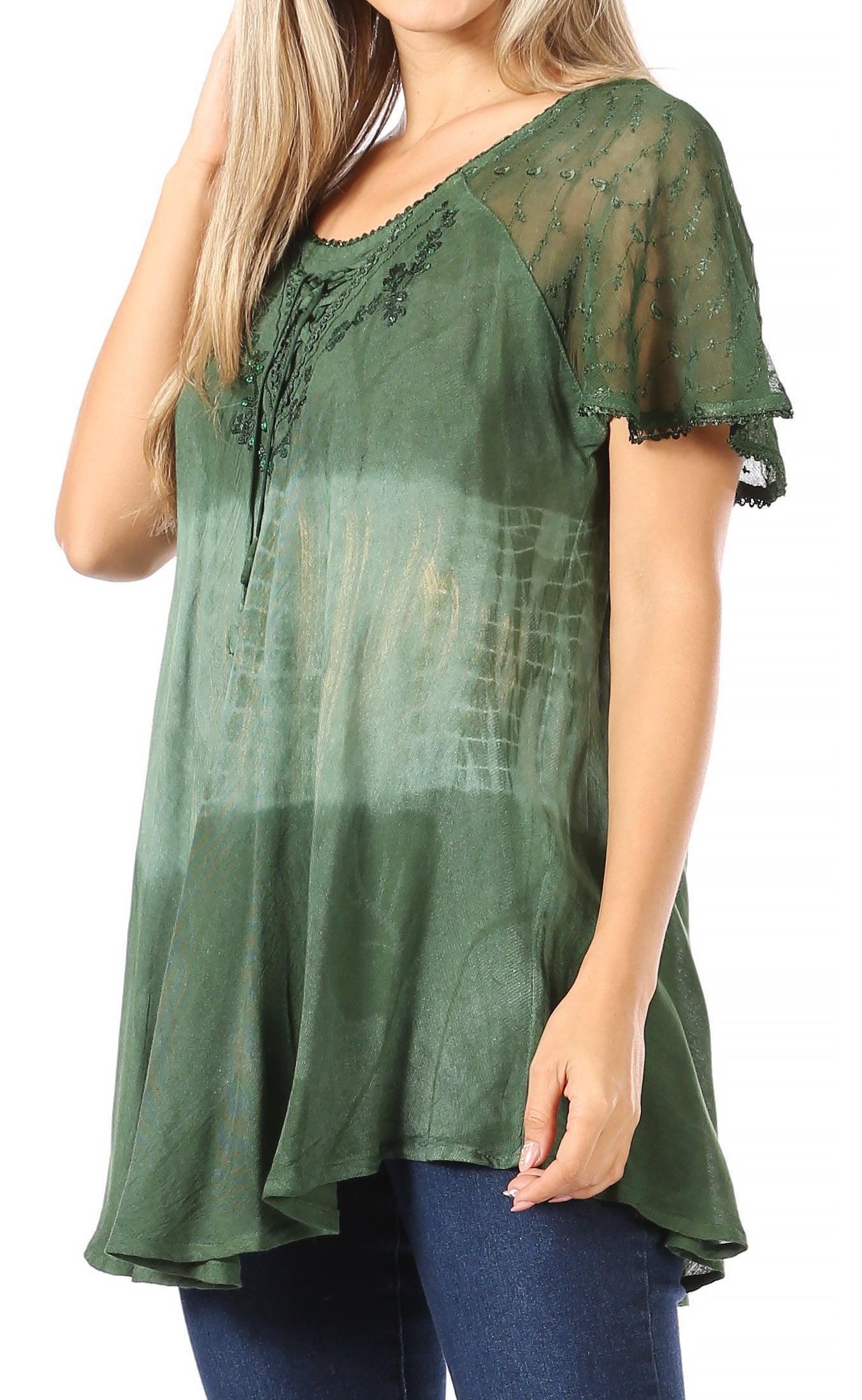 Green lace top worn by a person on a white background