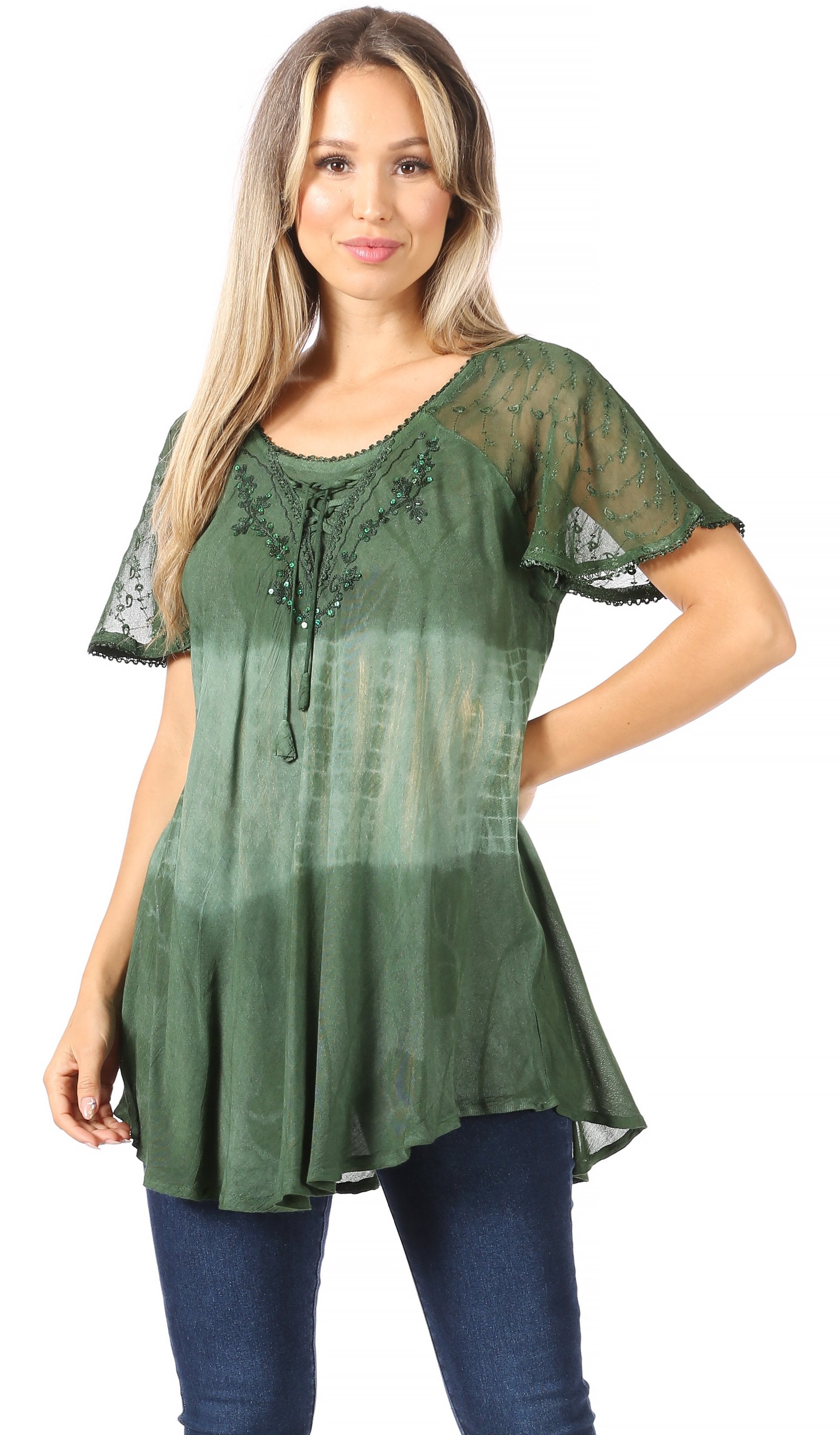 Woman wearing a green lace top with a white background