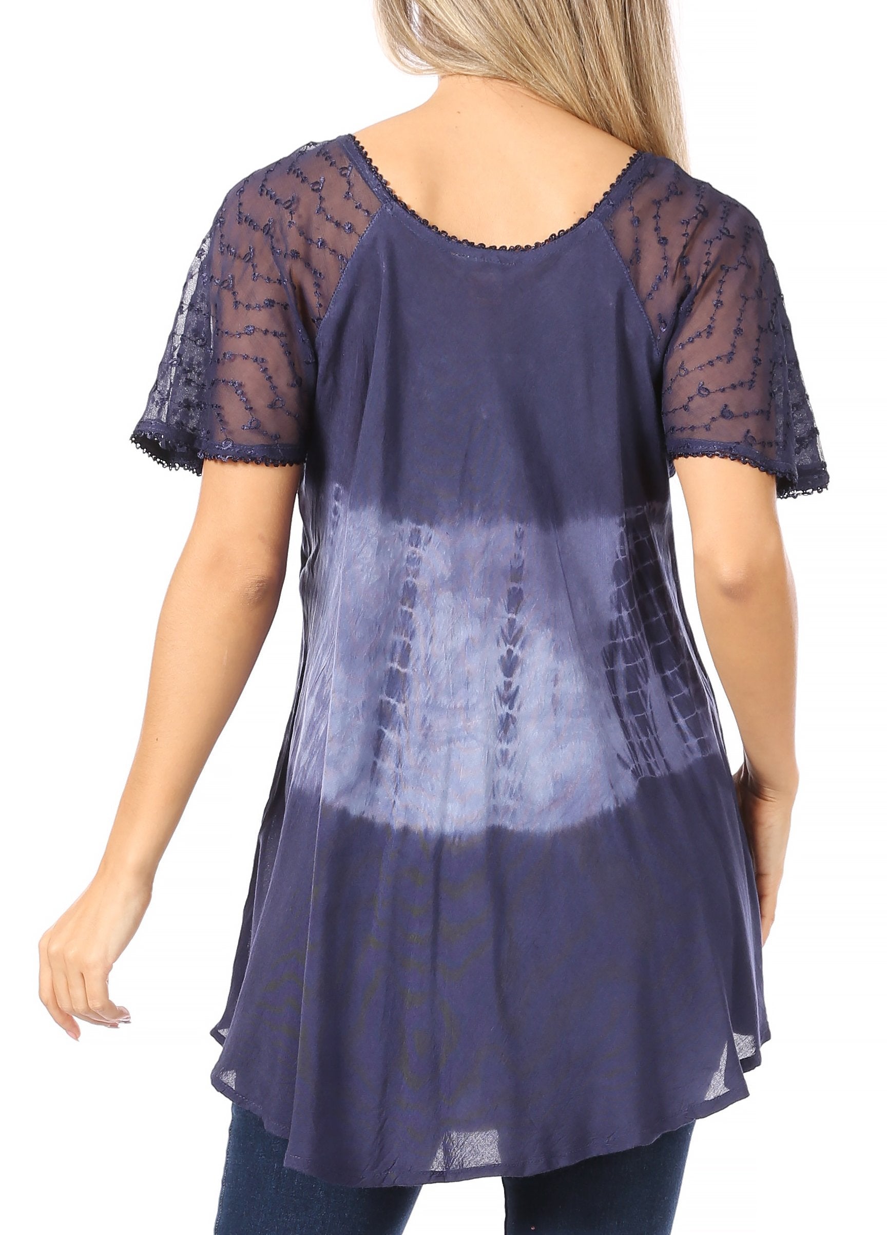 Navy blue lace overlay top worn by a model on a white background