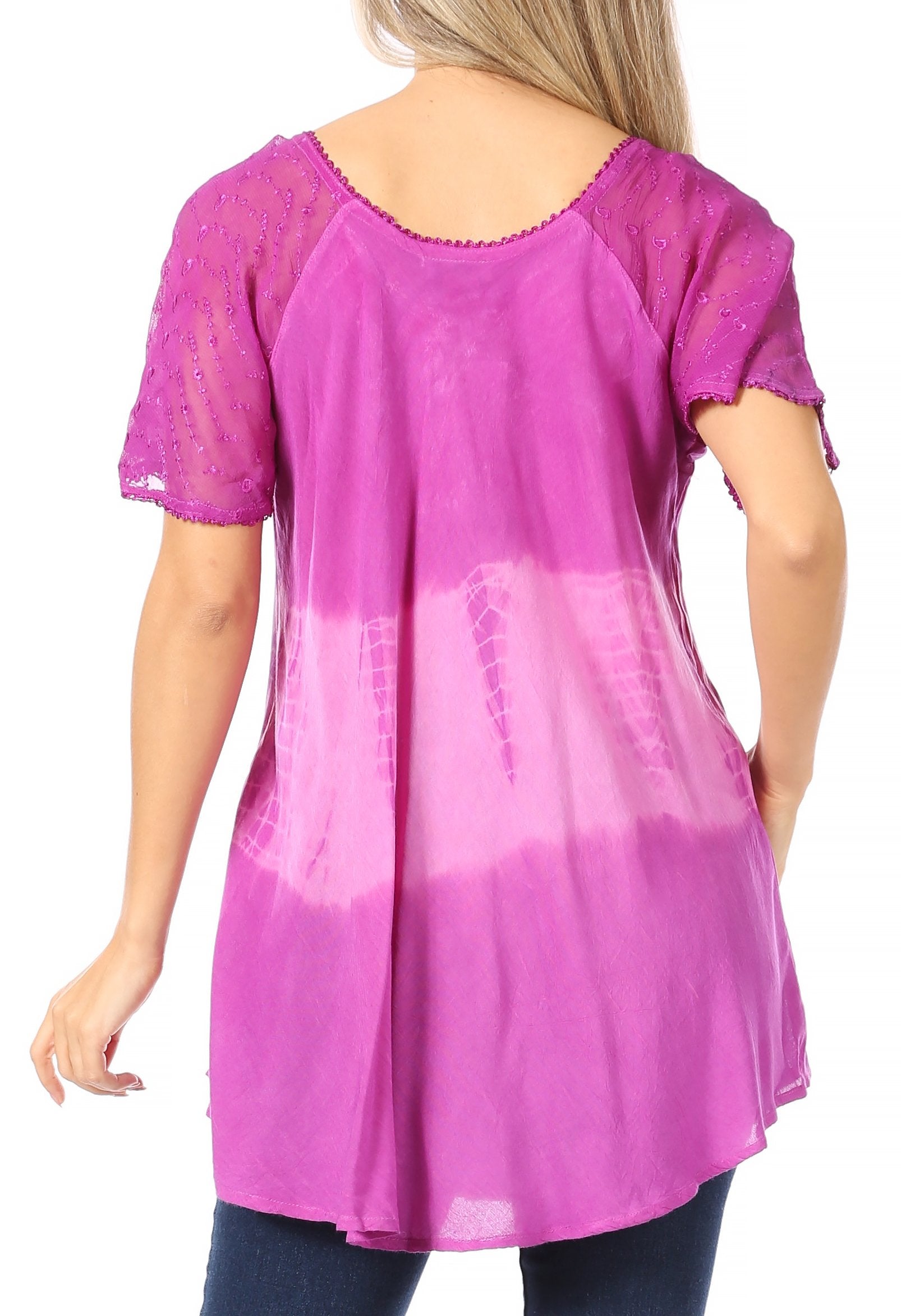 Woman wearing a purple lace top with a white background