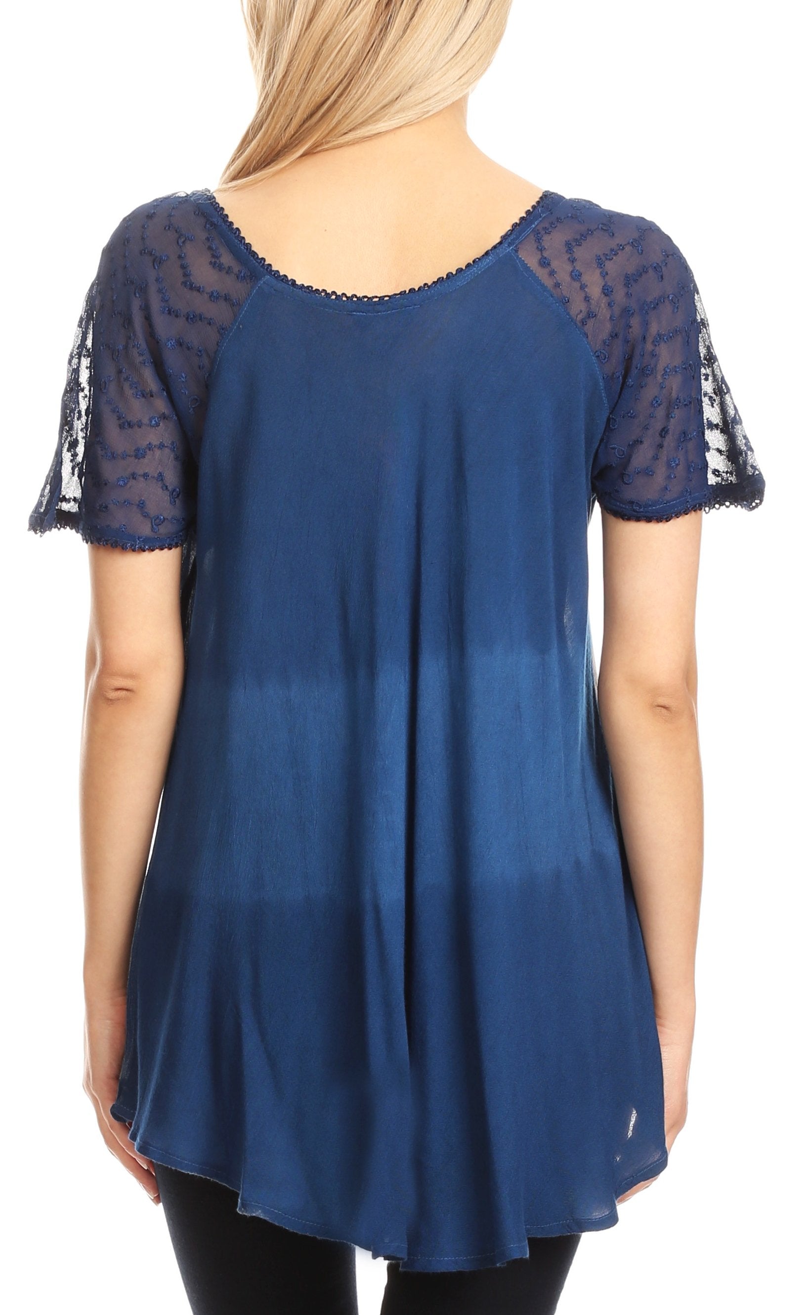 Blue top with lace sleeves worn by a person on a white background