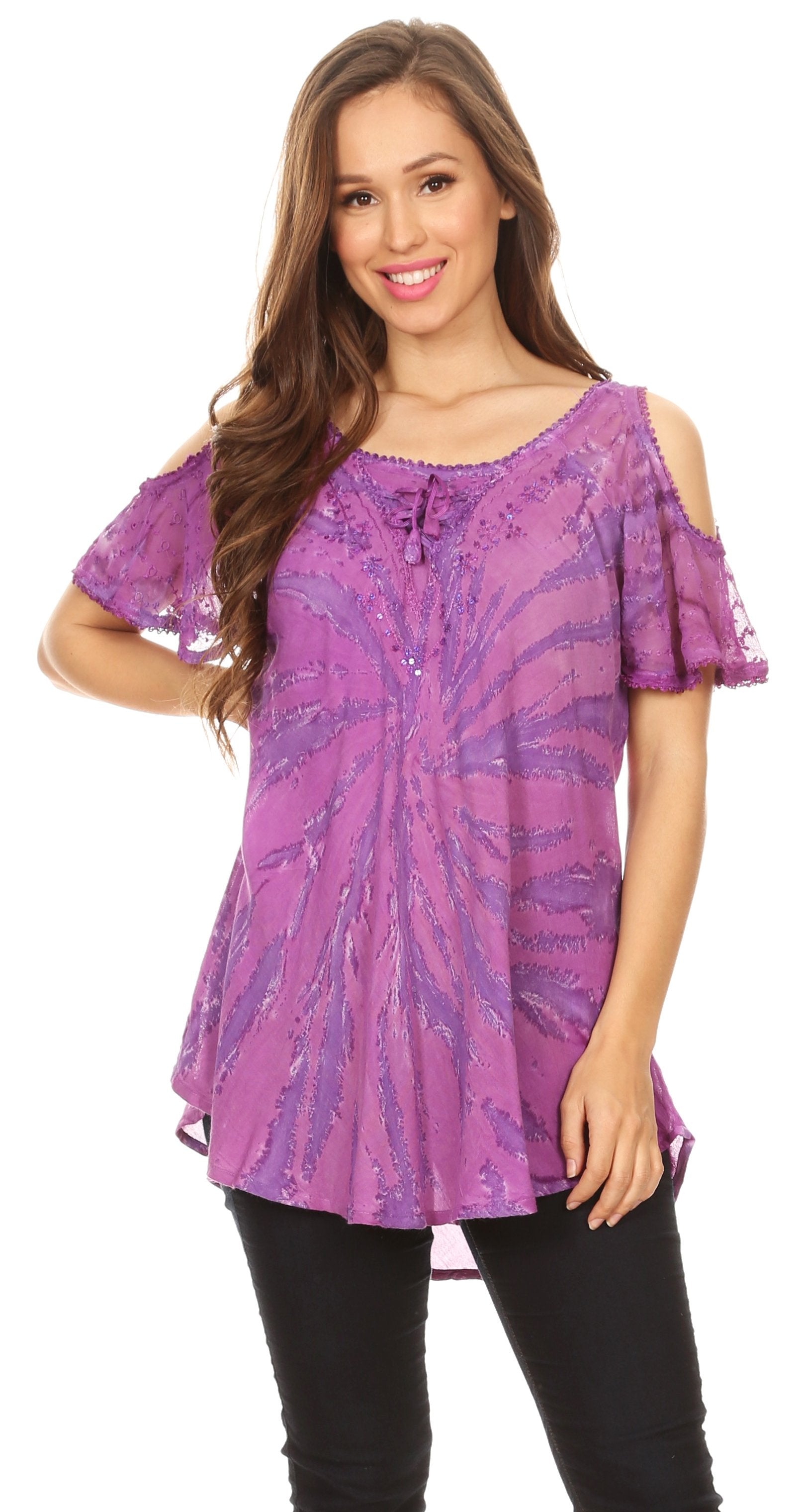Woman wearing a purple tie-dye top with cold shoulder design on a white background