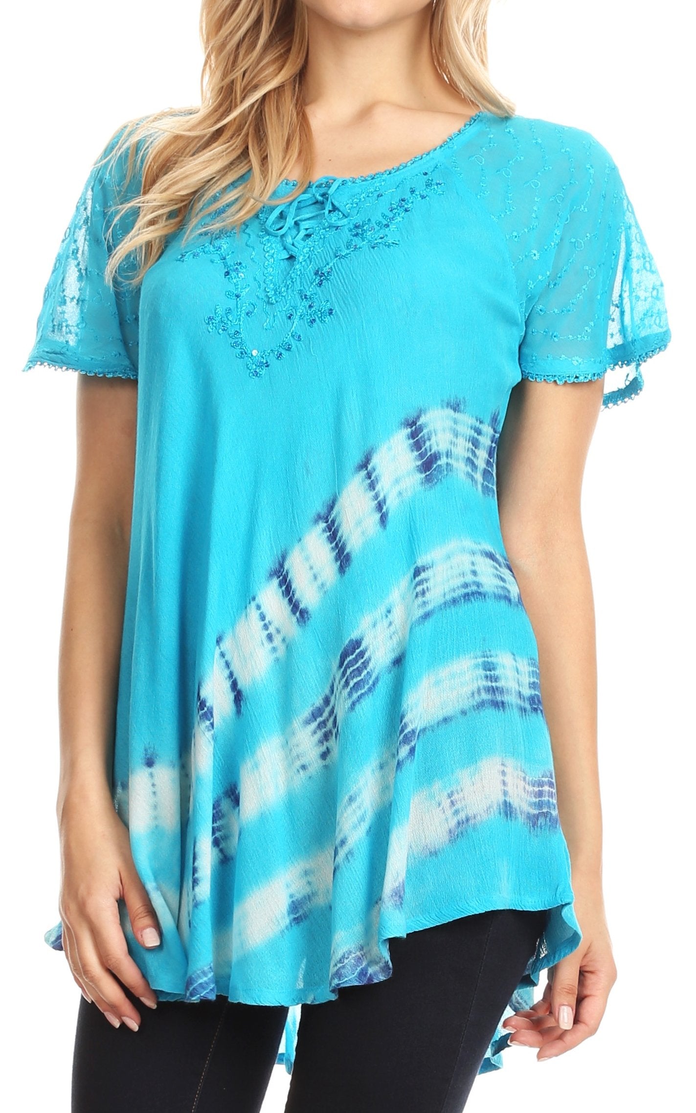 Woman wearing a blue tie-dye top with lace details
