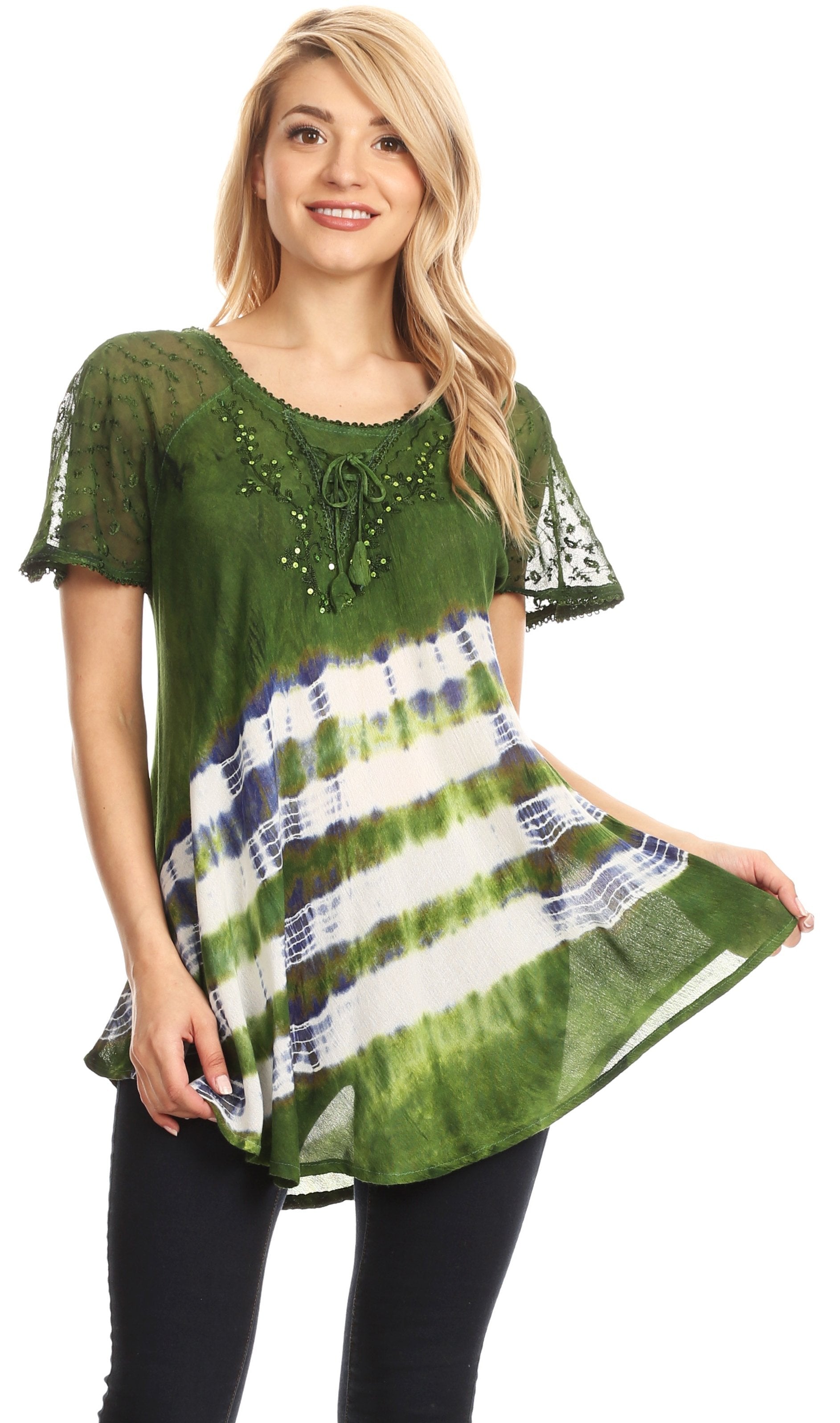 Woman wearing a green and patterned top on a white background