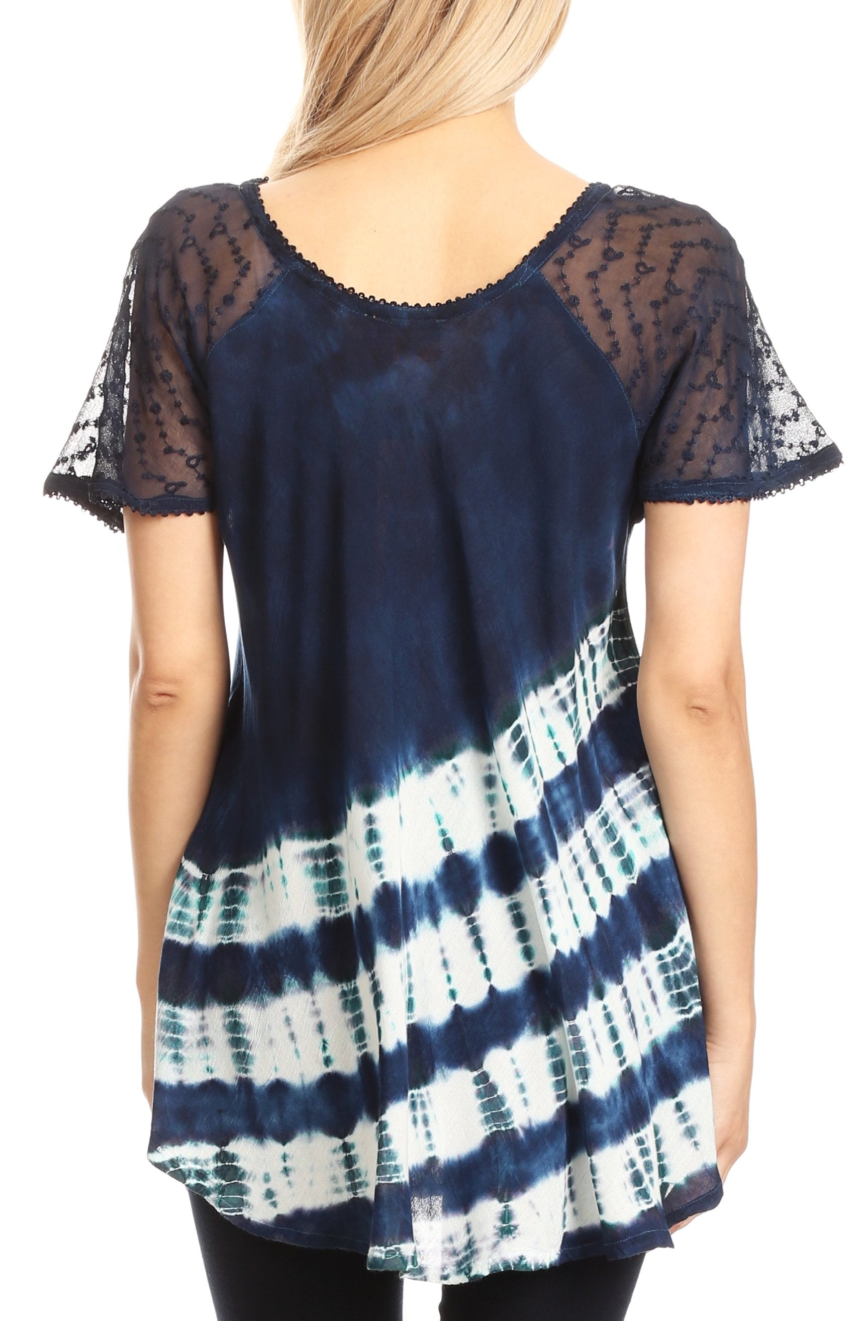 Navy and white tie-dye top with sheer sleeves worn by a model on a white background