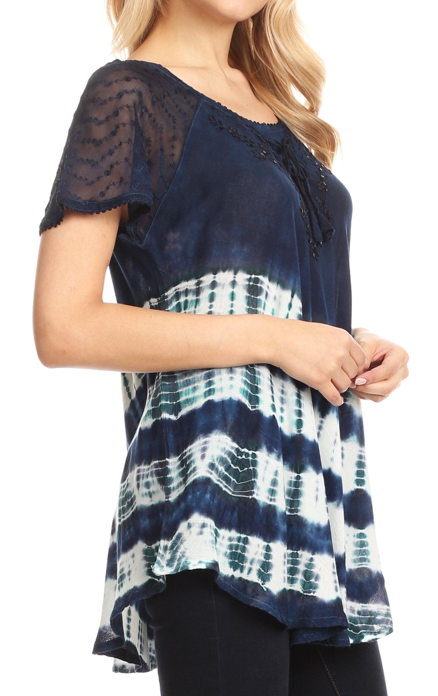 Navy and white tie-dye top with sheer sleeves worn by a model on a white background