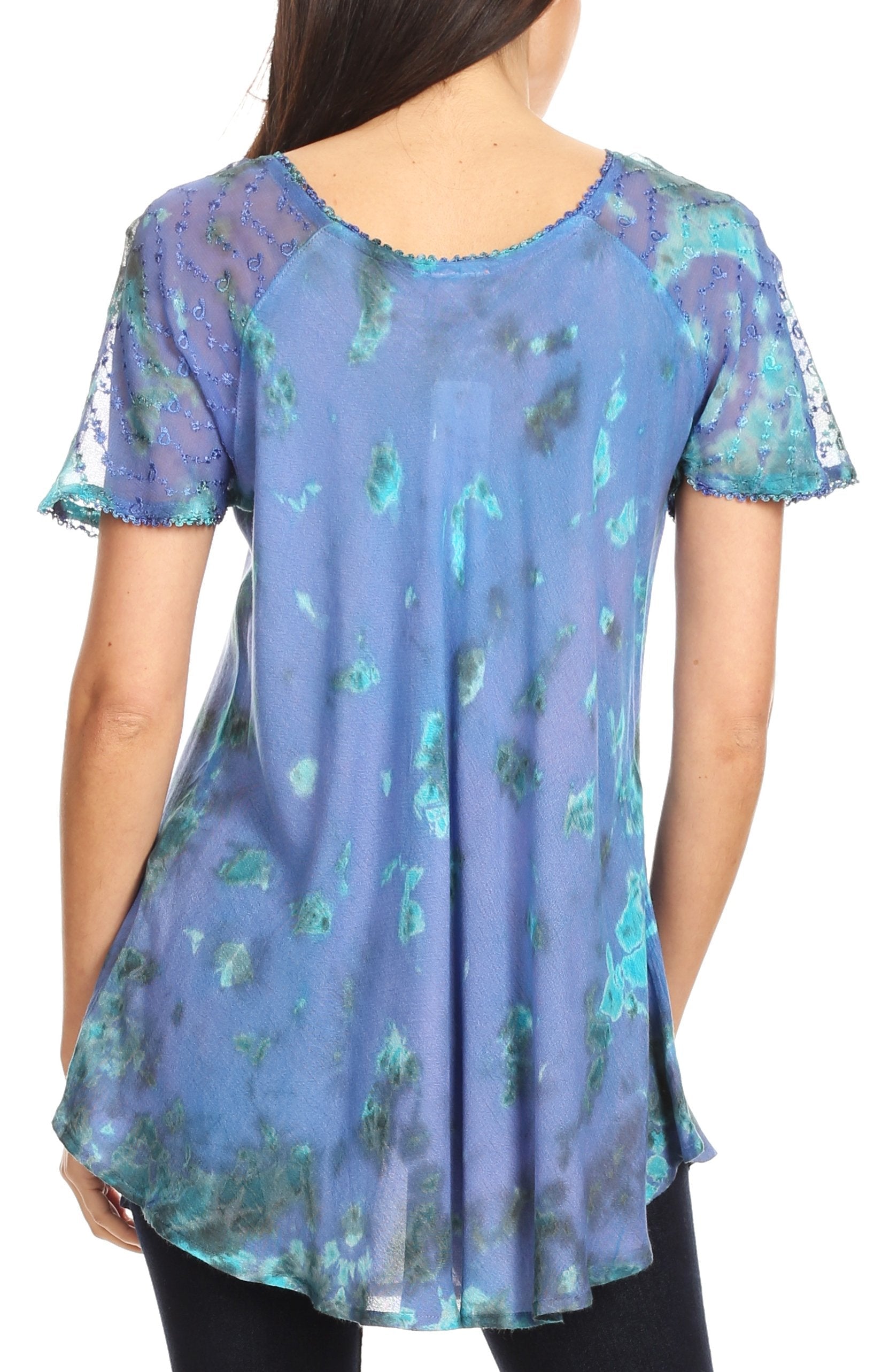 Blue floral patterned top worn by a person on a white background