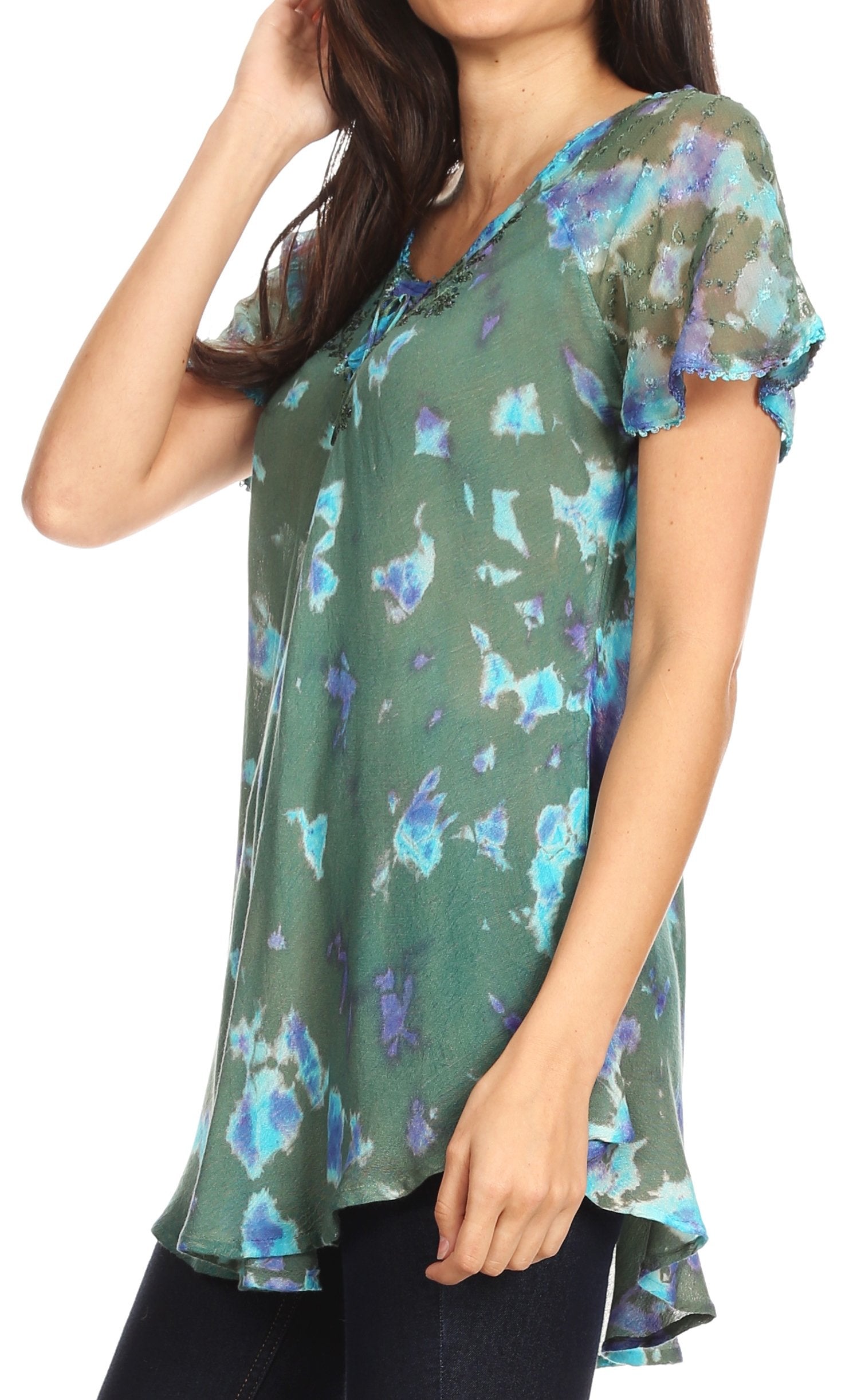 Woman wearing a green floral blouse on a white background