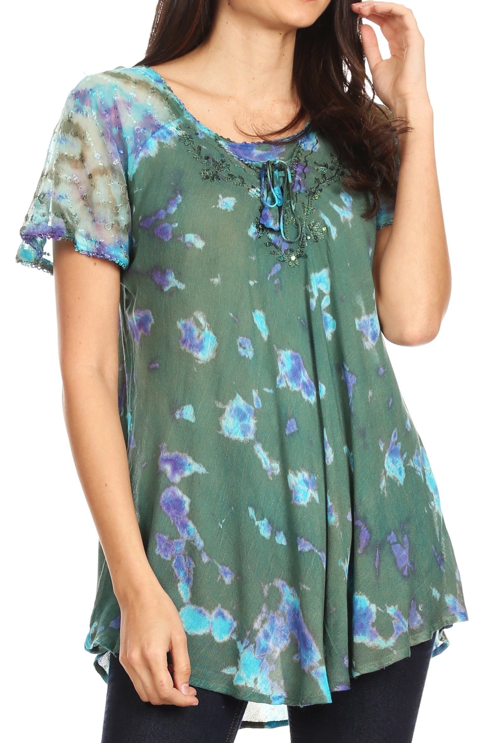 Woman wearing a green floral blouse with short sleeves on a white background