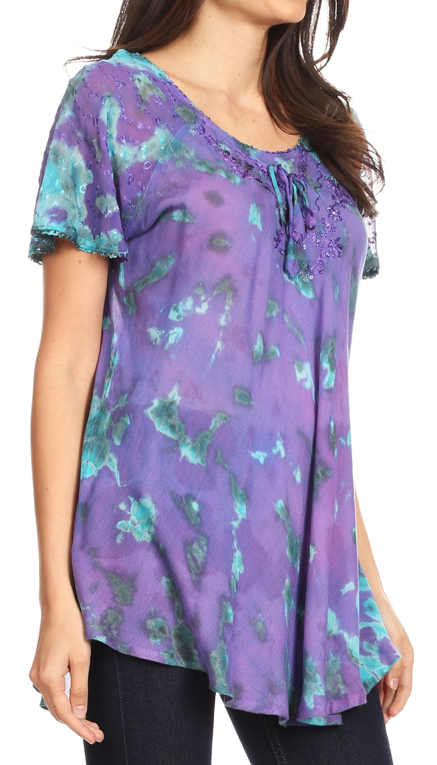 Woman wearing a purple floral blouse on a white background