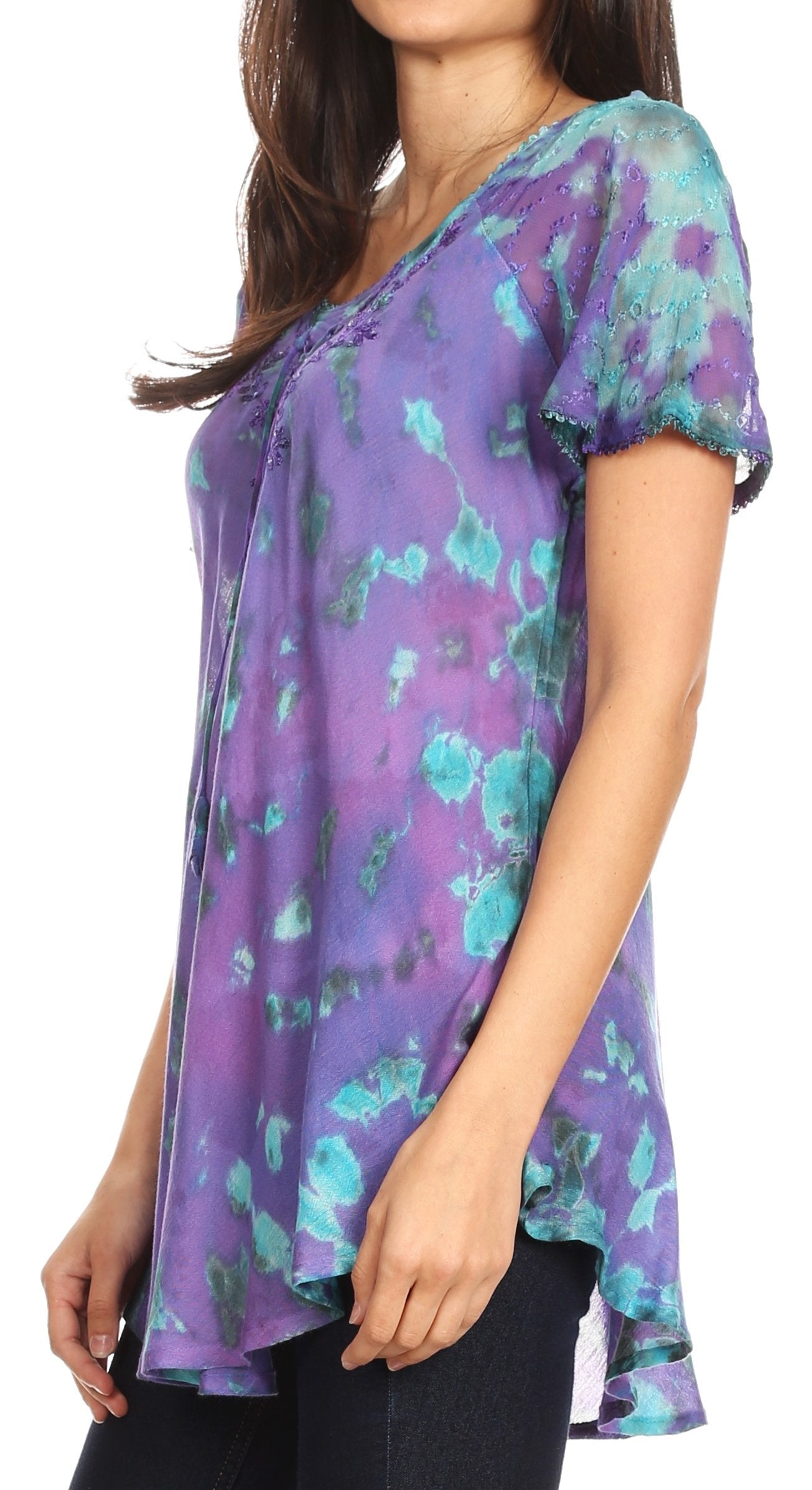 Purple floral patterned top worn by a person on a white background