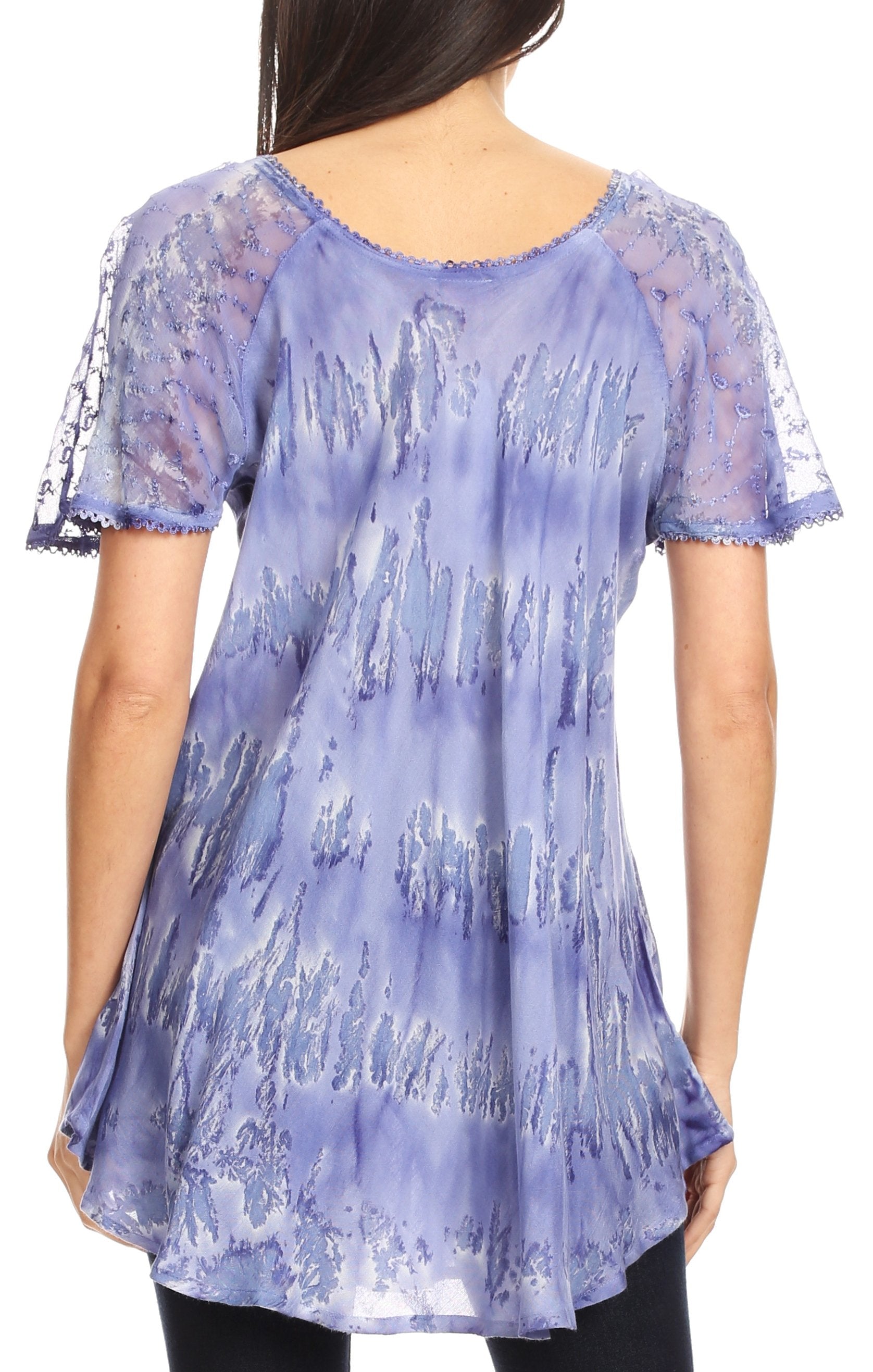 Woman wearing a purple lace top with sheer sleeves on a white background
