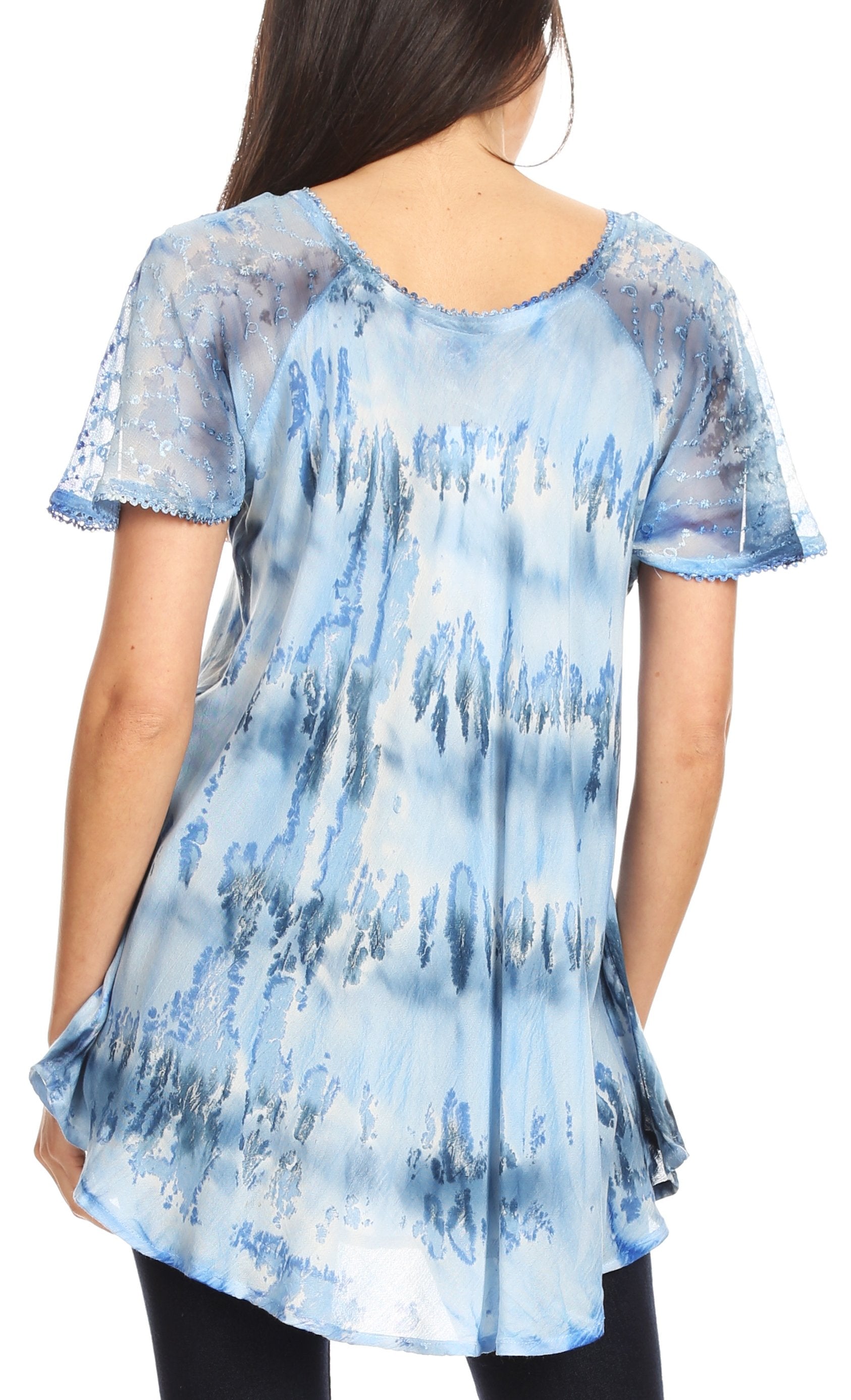Woman wearing a blue tie-dye blouse on a white background