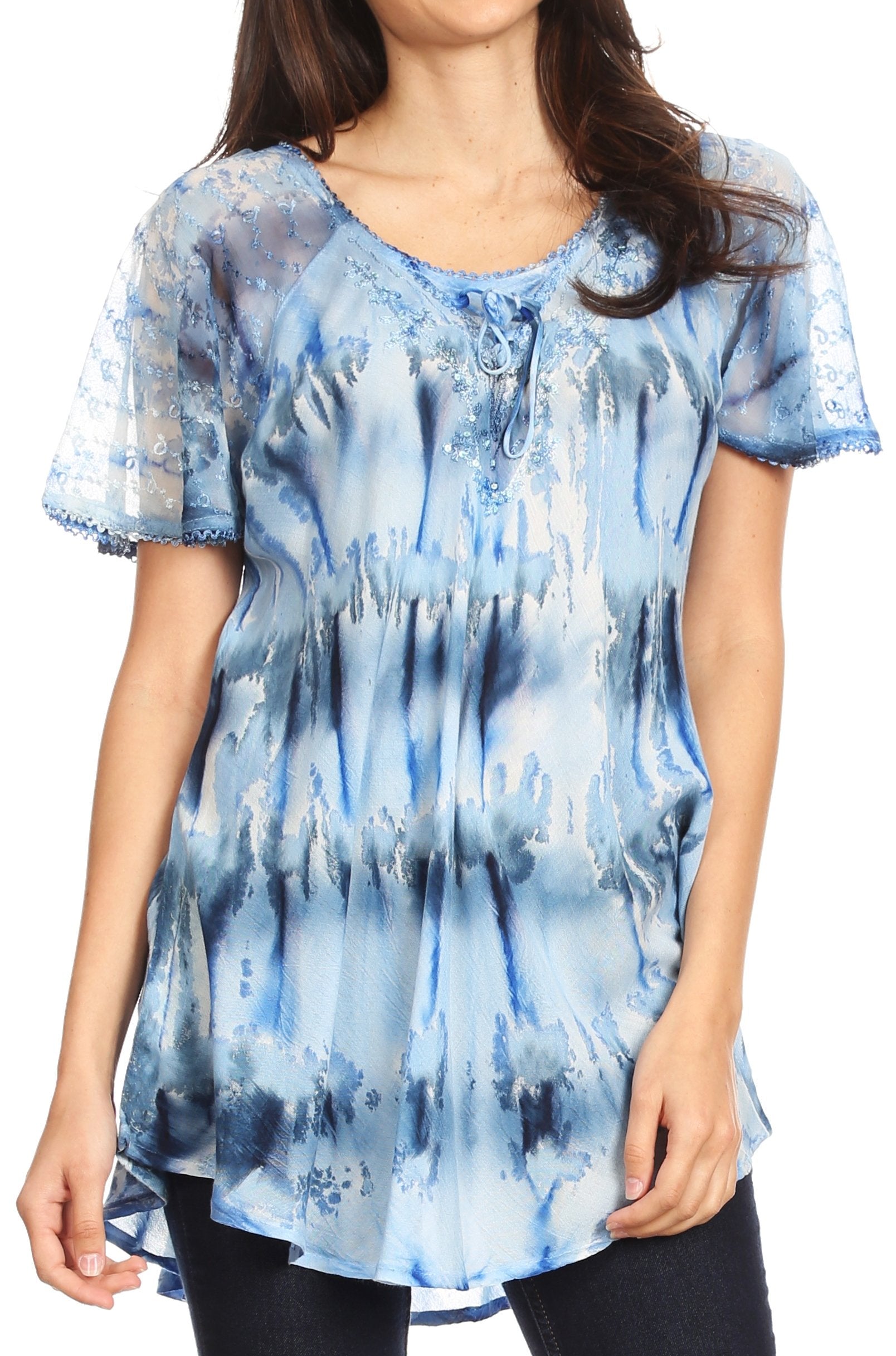 Woman wearing a blue tie-dye blouse with a white background