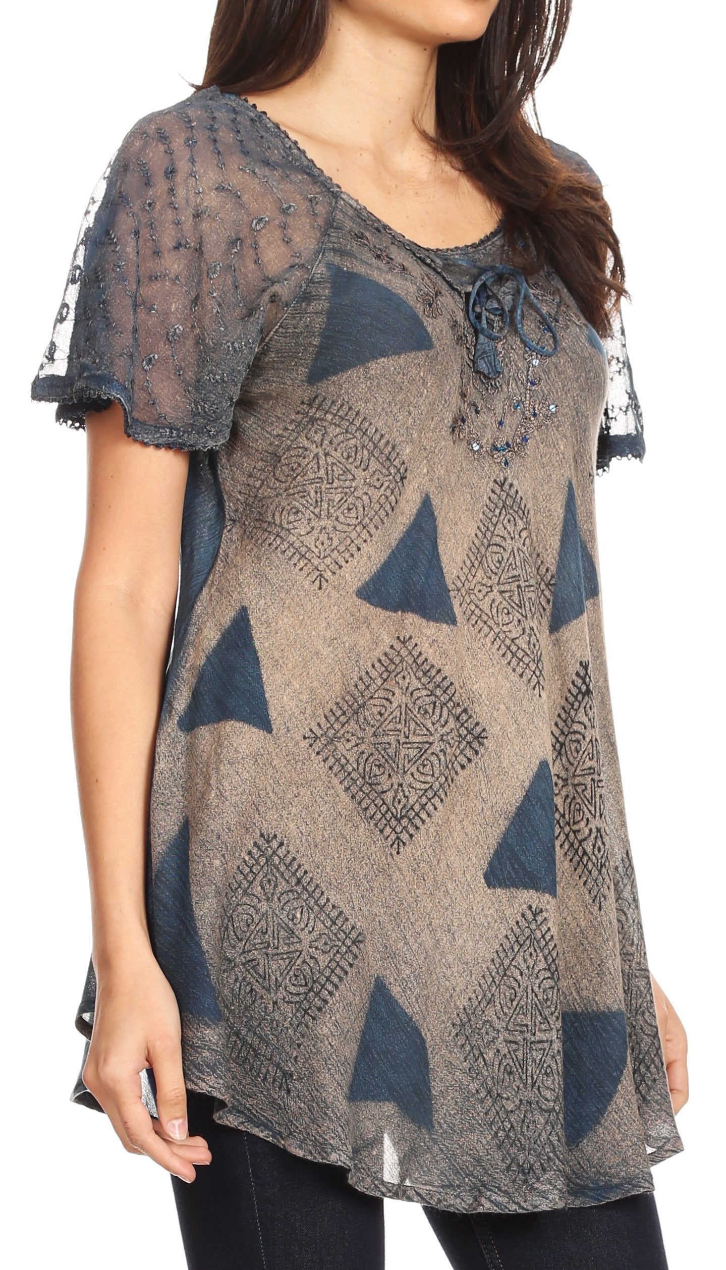 Woman wearing a patterned blouse with geometric design on a white background