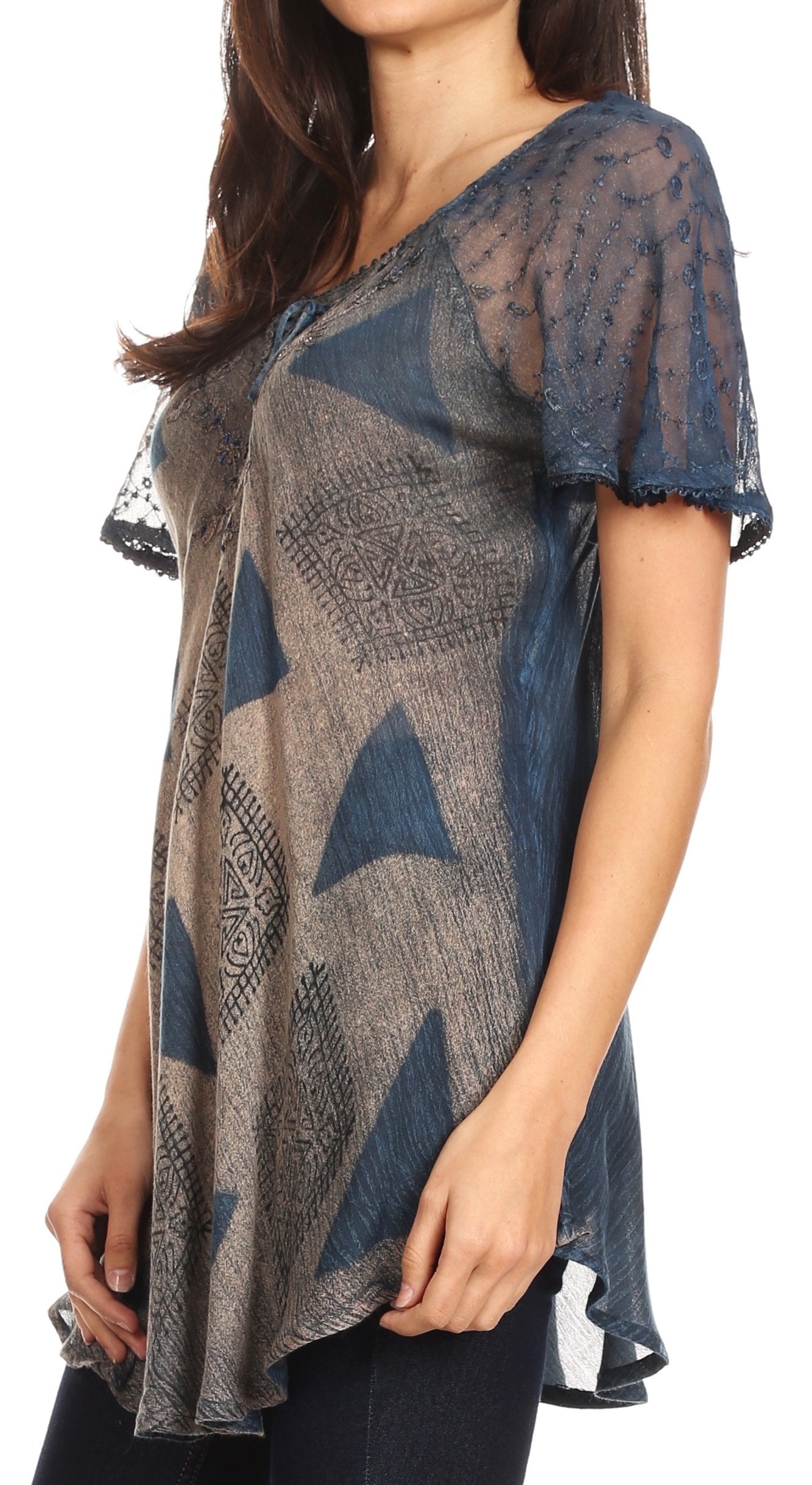 Woman wearing a patterned sheer top with short sleeves on a white background