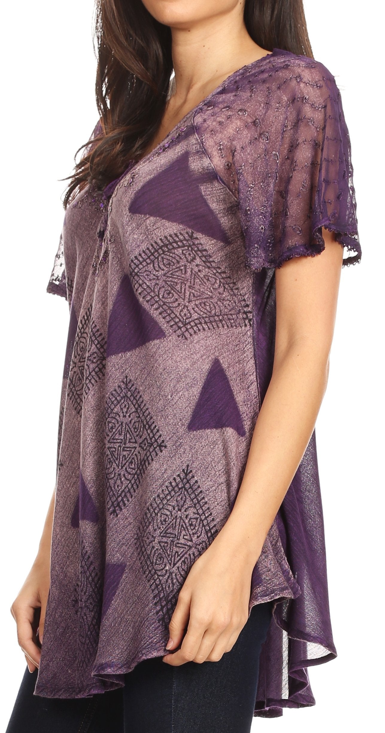 Woman wearing a purple patterned top on a white background