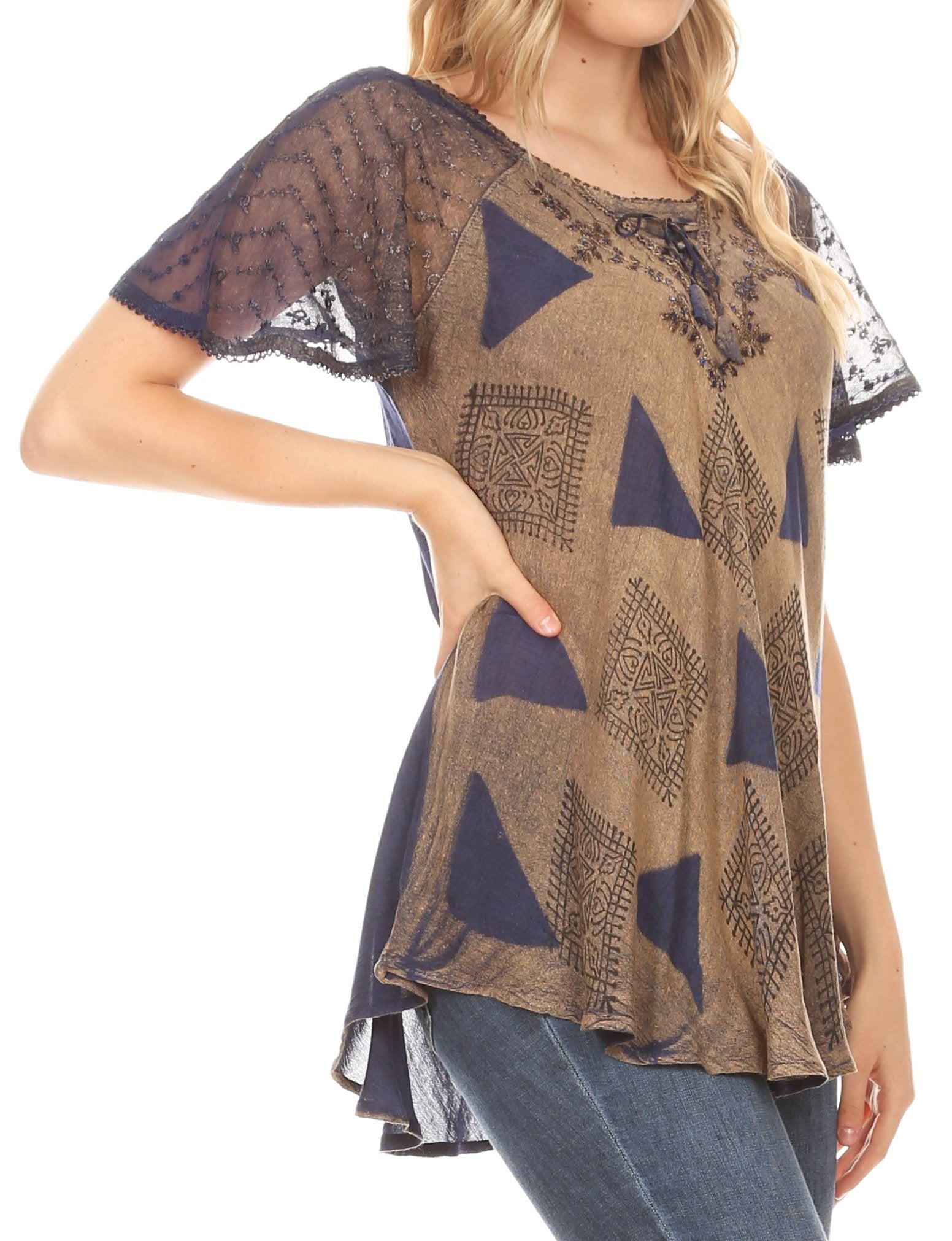 Woman wearing a patterned top with lace sleeves on a white background