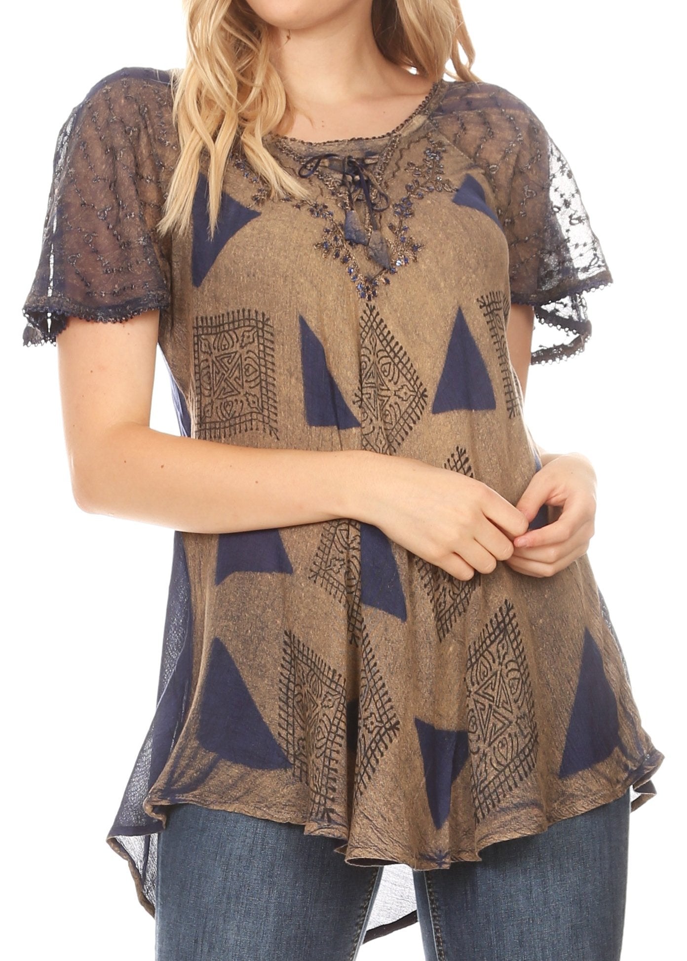 Woman wearing a patterned top with lace sleeves on a white background