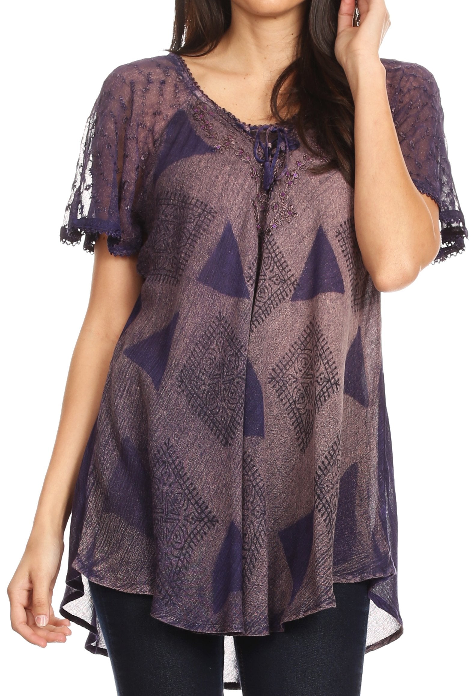 Woman wearing a patterned purple top with short sleeves on a white background