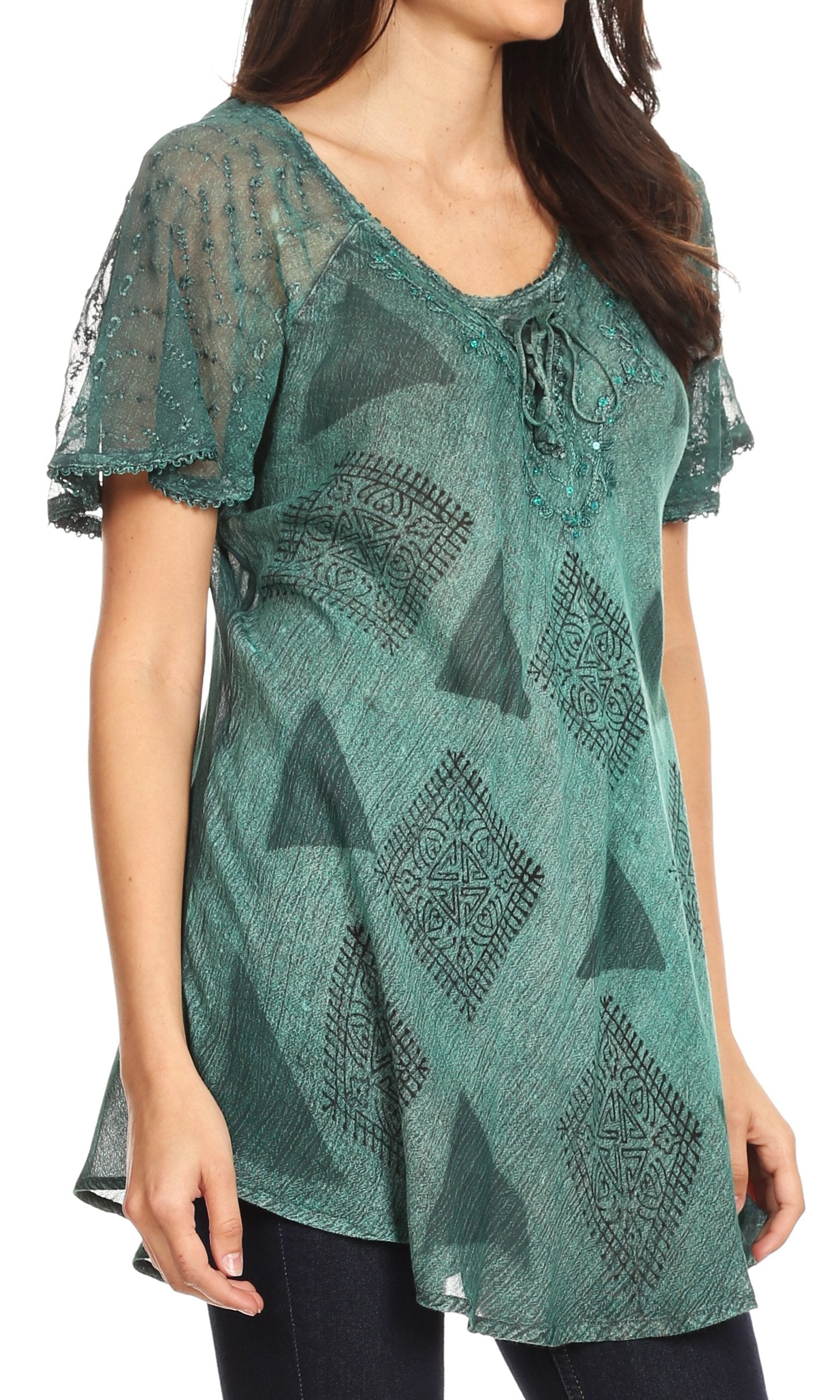 Green patterned blouse worn by a model on a white background