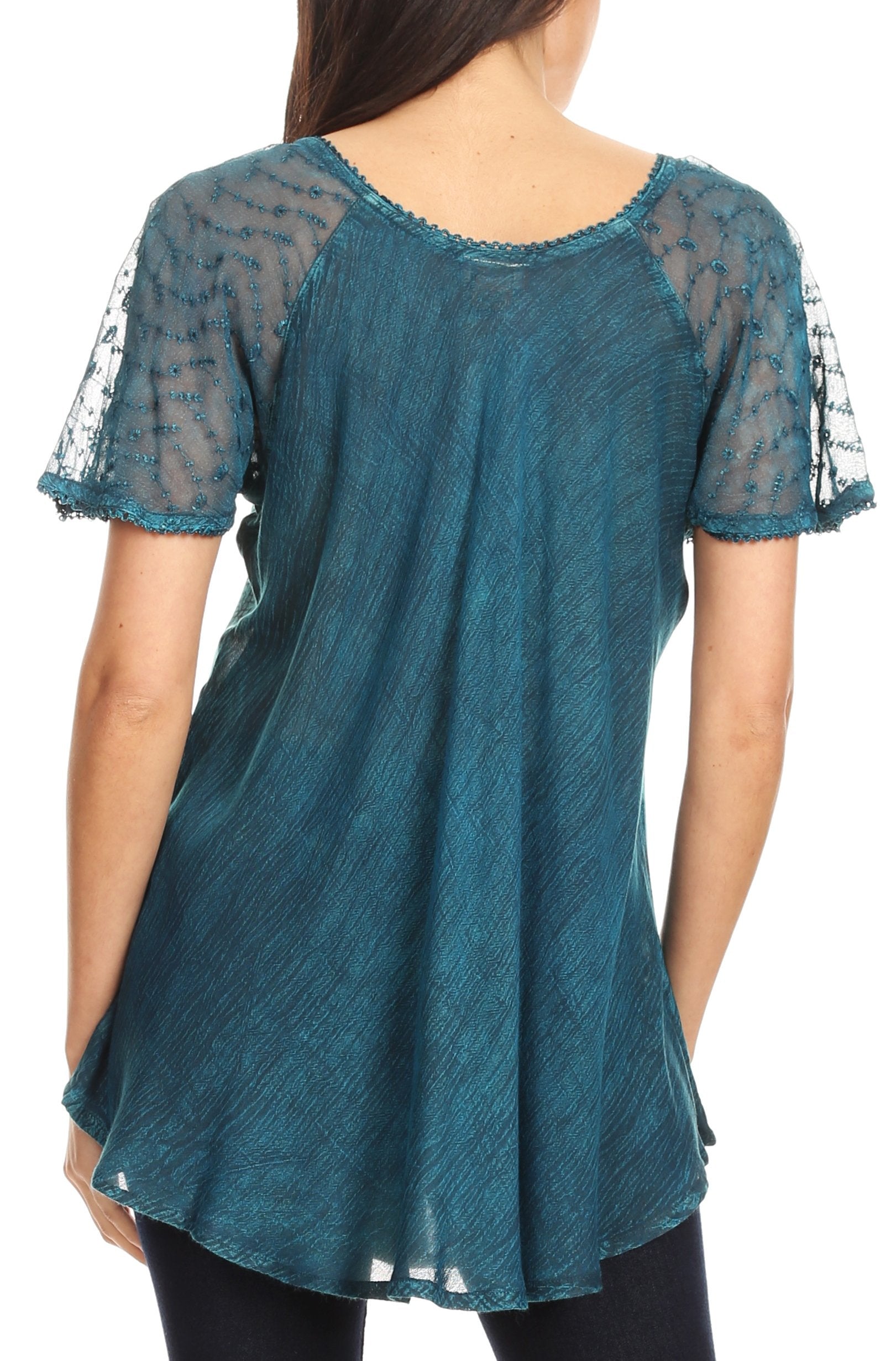 Teal lace top worn by a person on a white background