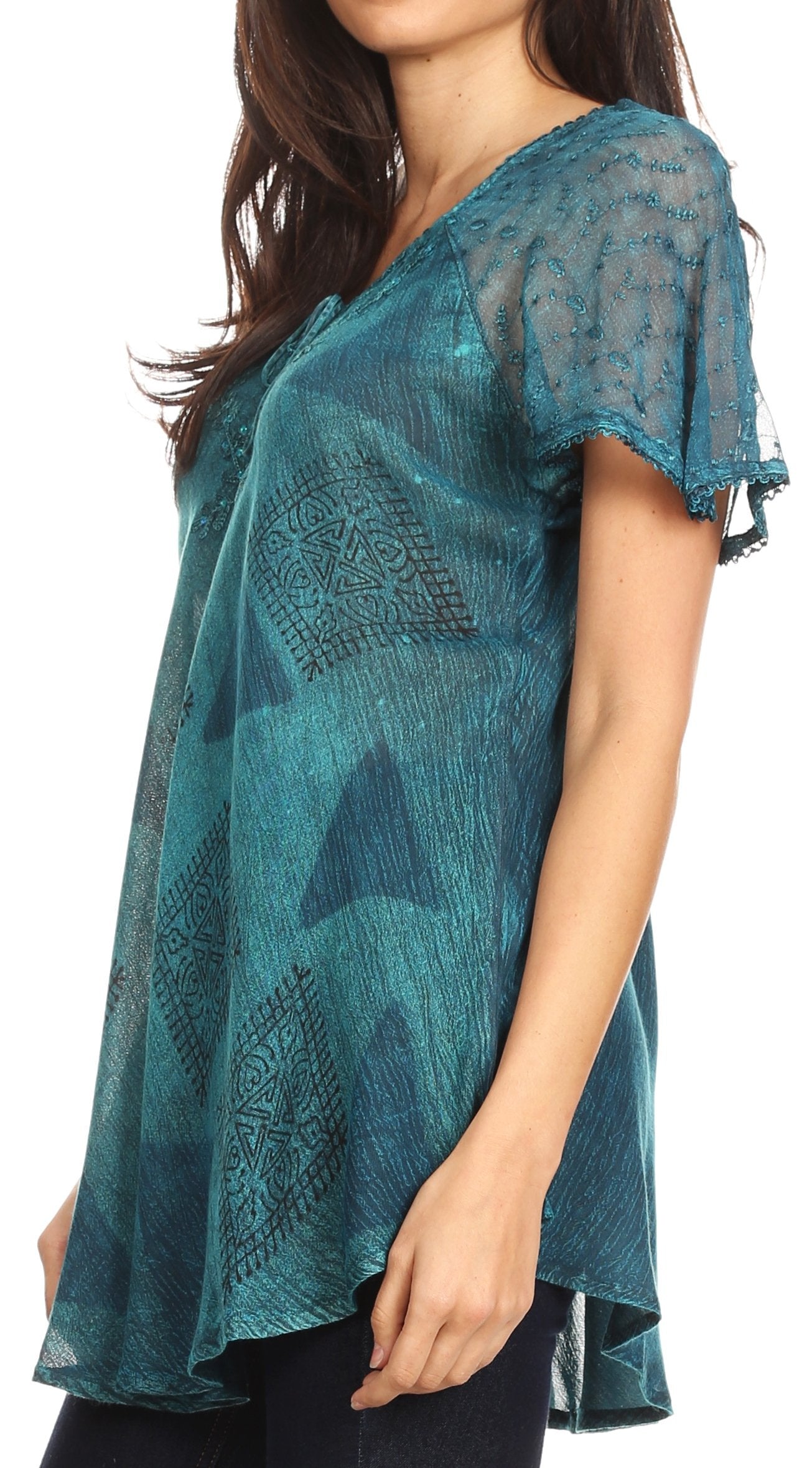Teal lace top worn by a model on a white background