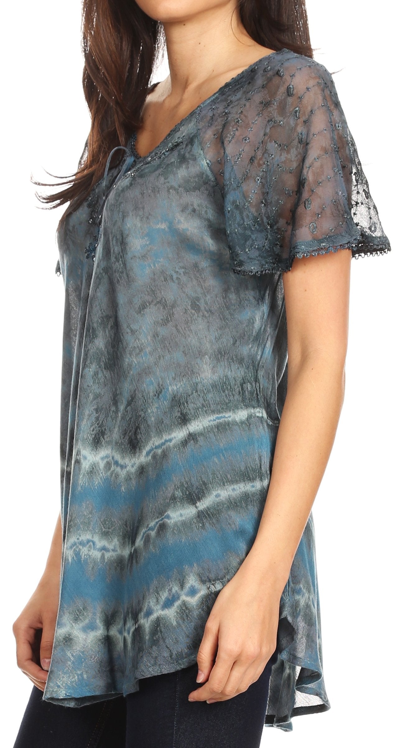 Woman wearing a sheer blouse with blue and gray pattern on a white background