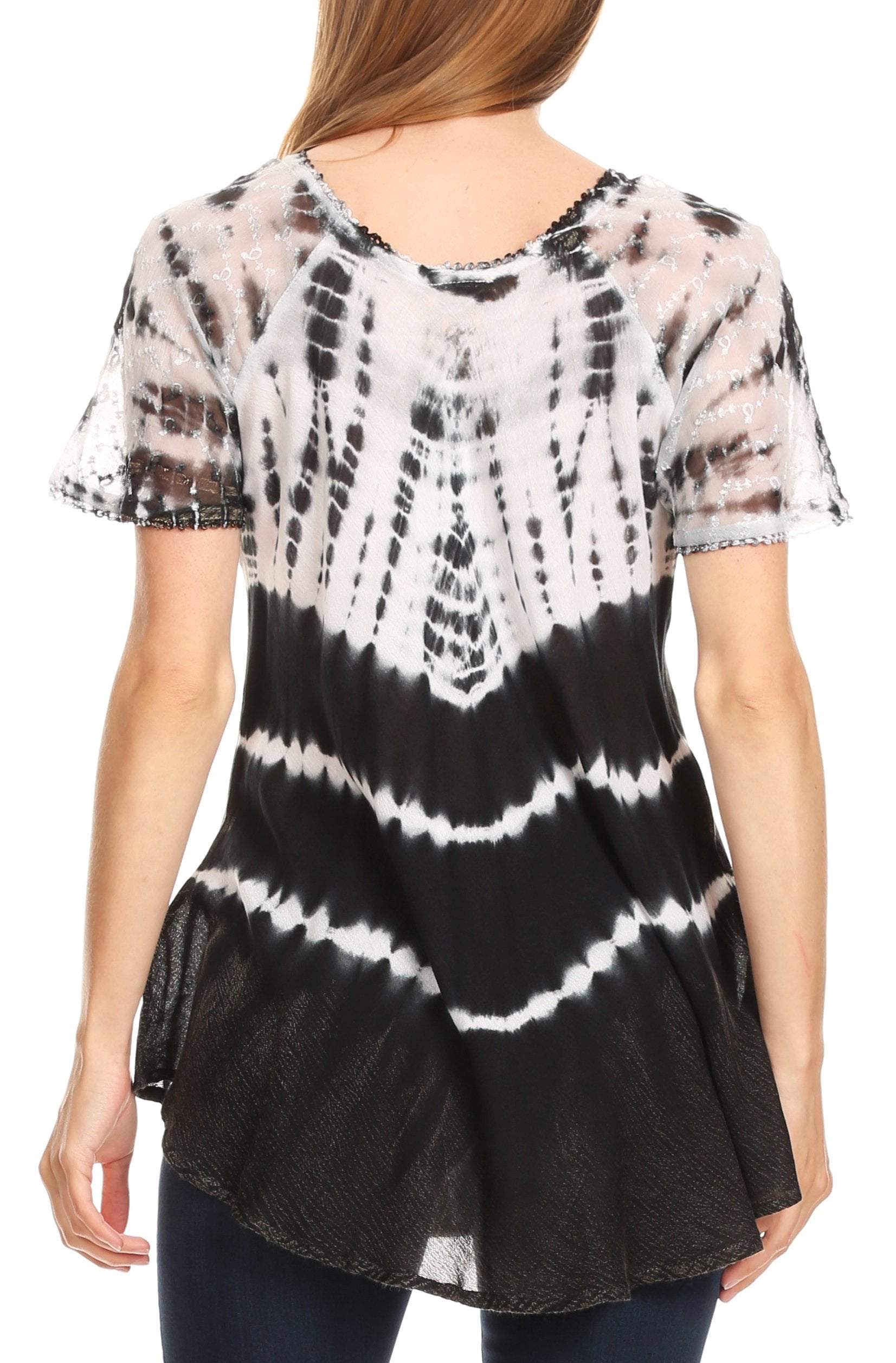 Black and white tie-dye top worn by a person on a white background