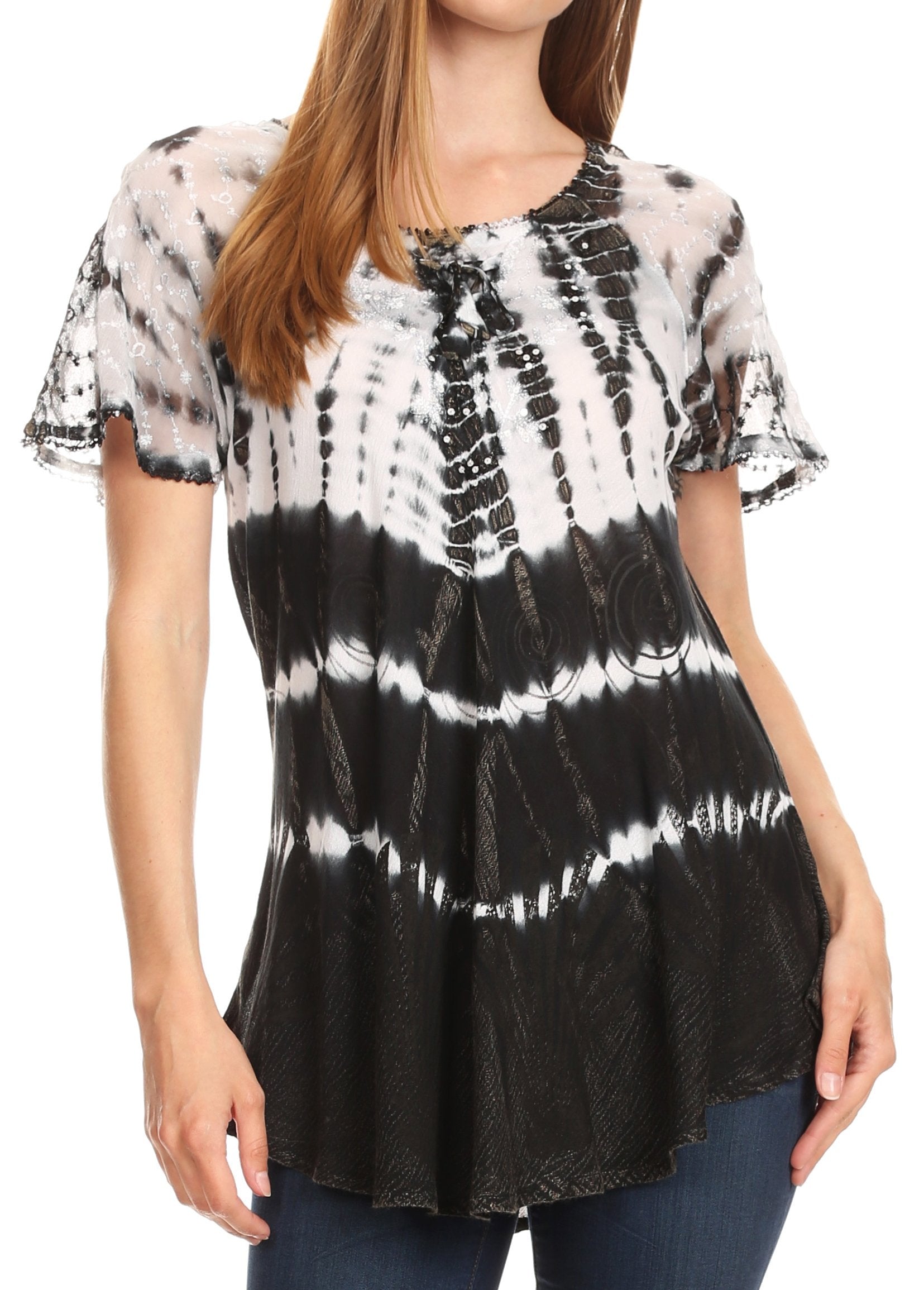 Woman wearing a black and white tie-dye blouse with ruffled sleeves on a white background