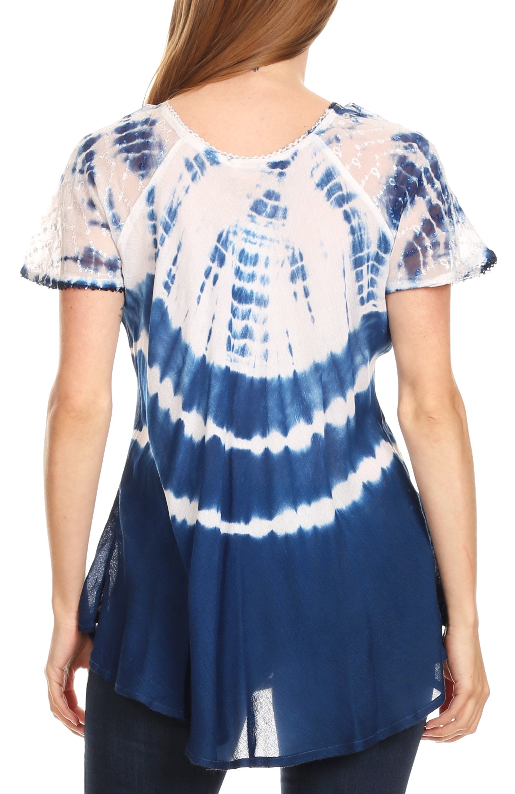 Blue and white tie-dye top worn by a person on a white background
