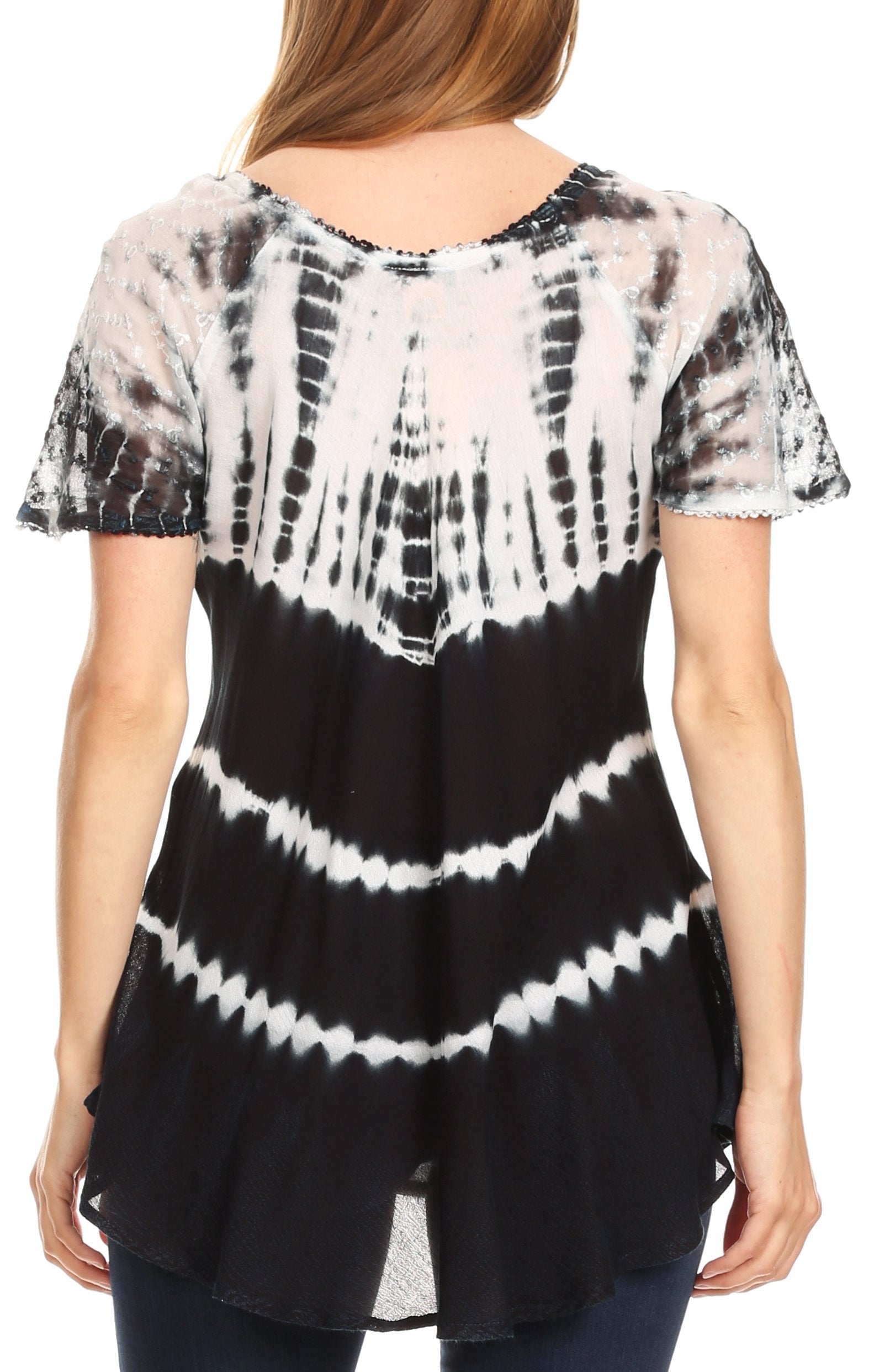 Black and white tie-dye top worn by a person on a white background