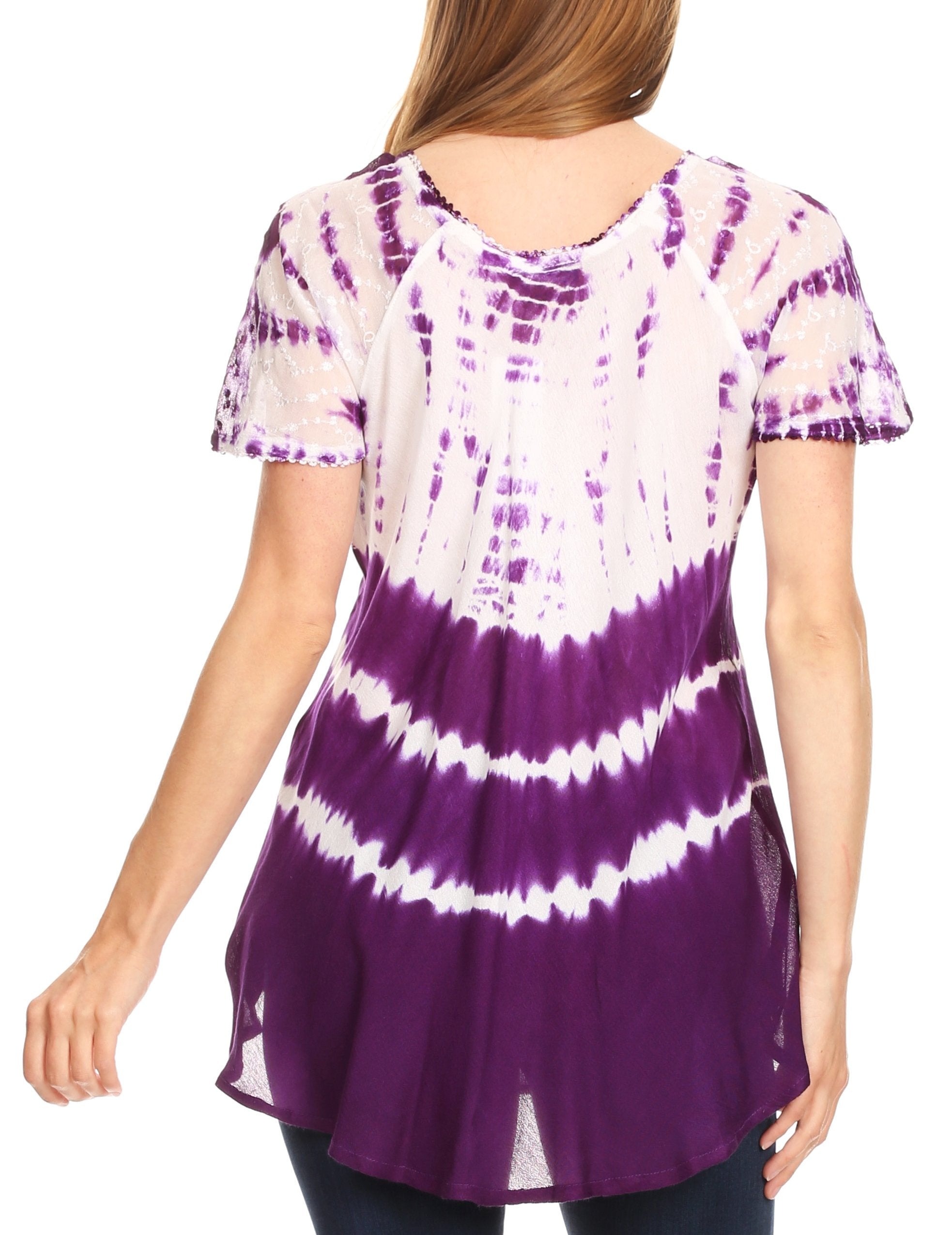 Purple and white tie-dye tunic worn by a person on a white background