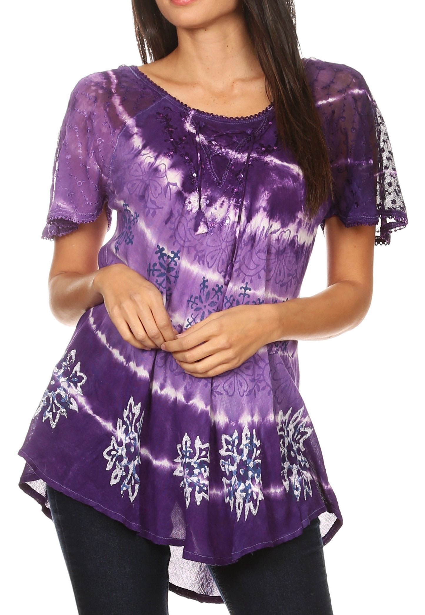 Purple tie-dye top with white patterns worn by a model on a white background