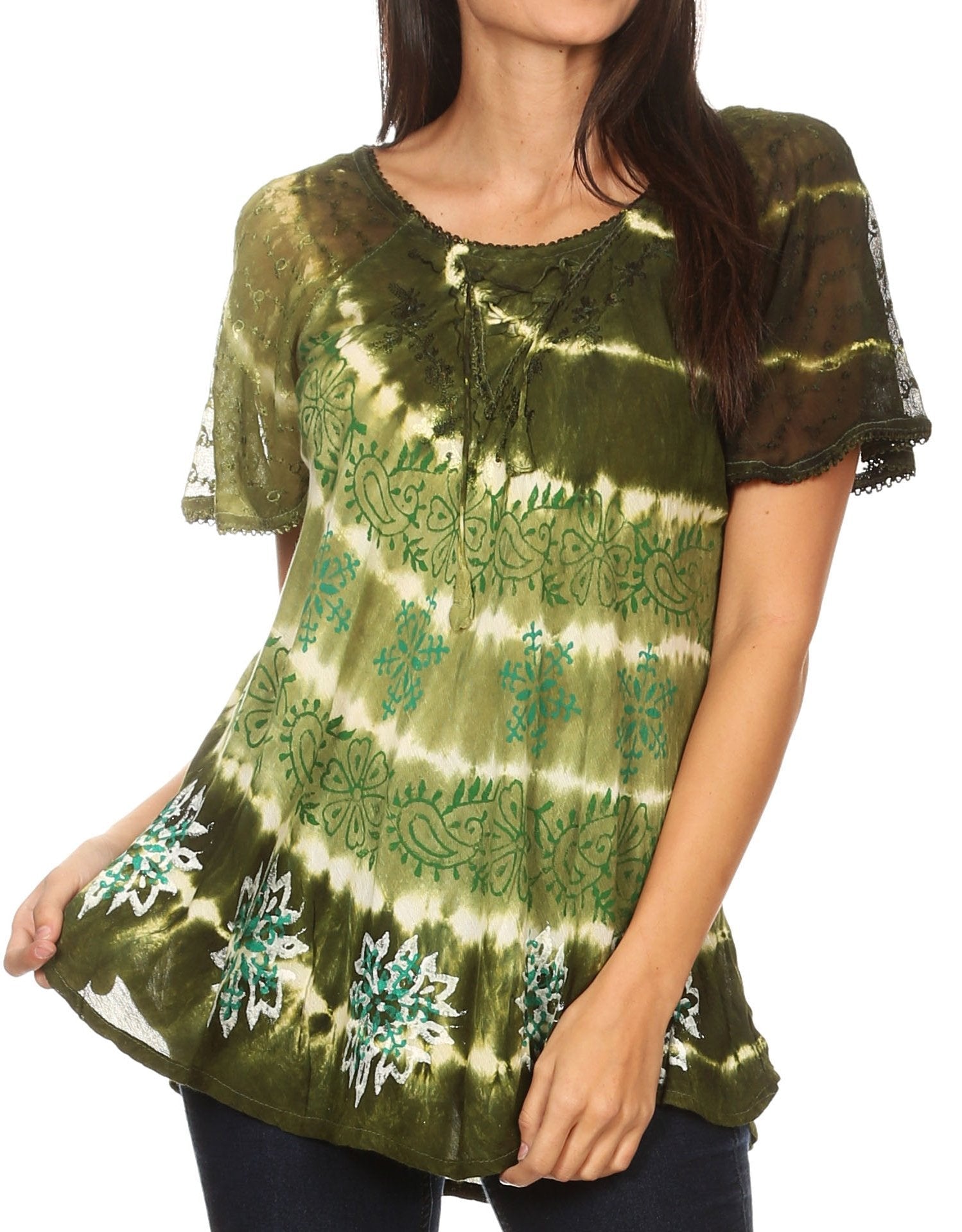Woman wearing a green tie-dye blouse with floral patterns on a white background