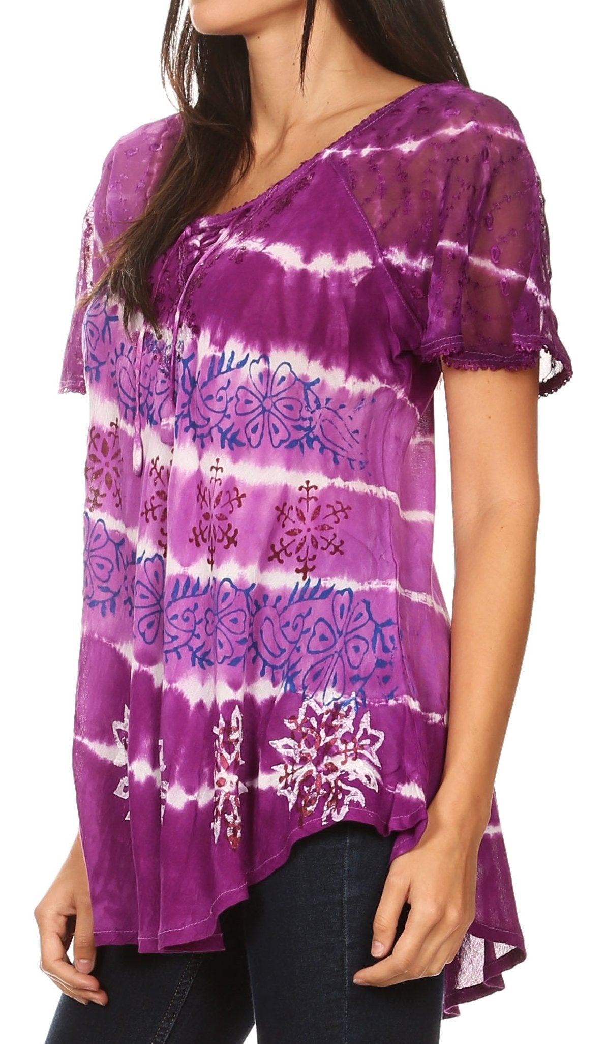 Purple tie-dye shirt with floral patterns worn by a person on a white background