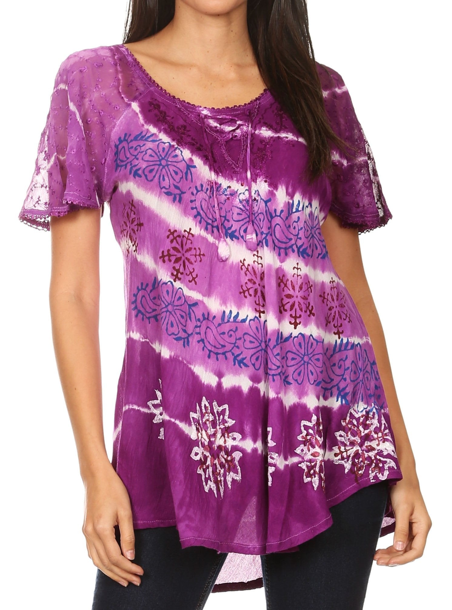 Purple tie-dye shirt with floral patterns worn by a model on a white background