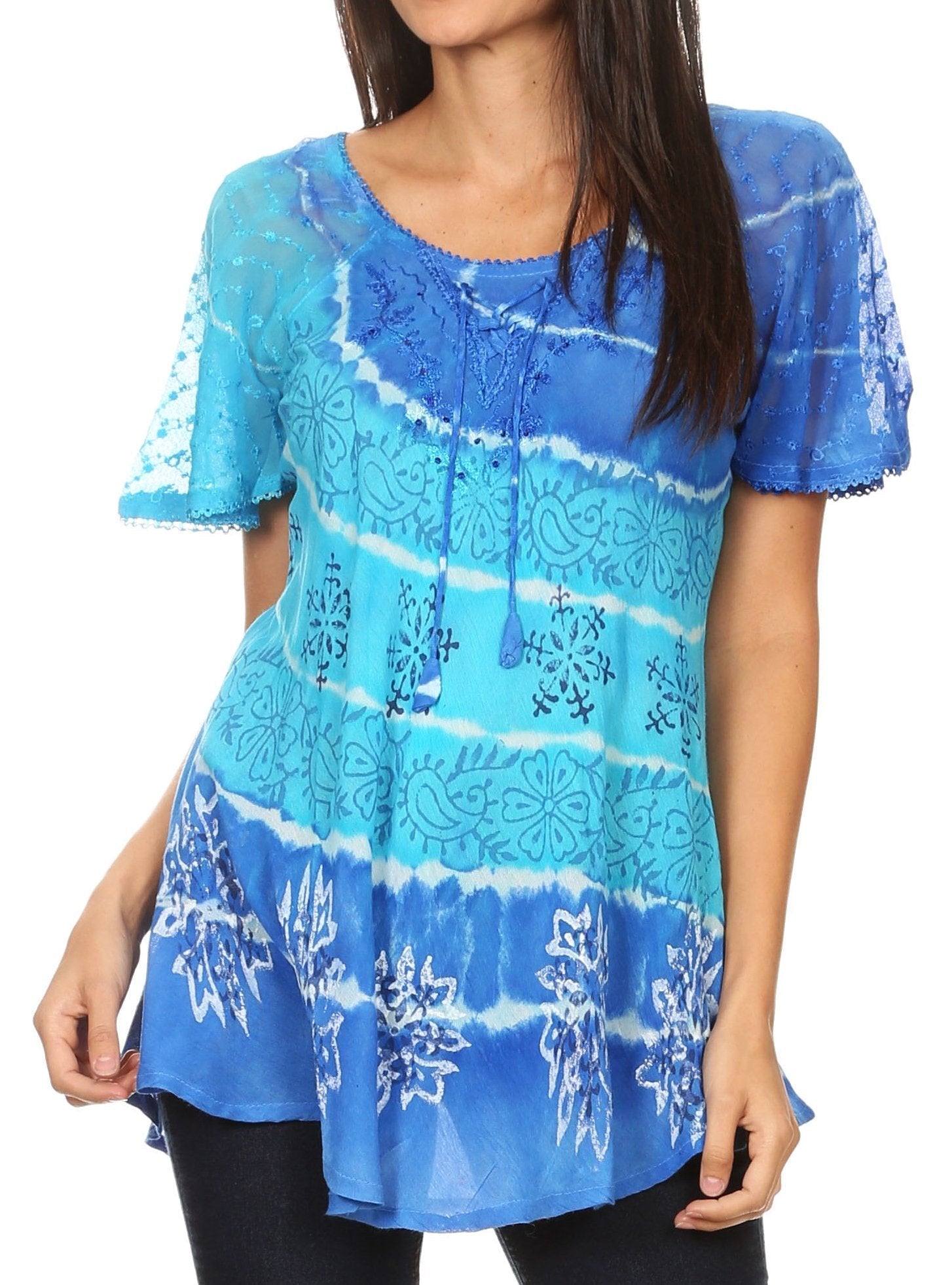 Blue tie-dye top worn by a model on a white background