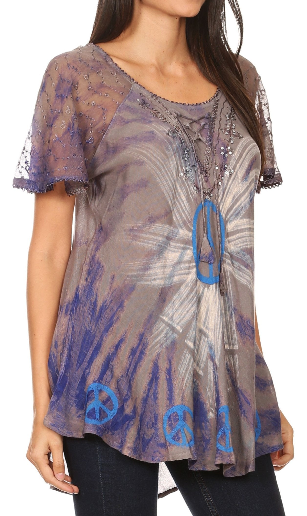 Woman wearing a sheer top with peace symbol design on a white background