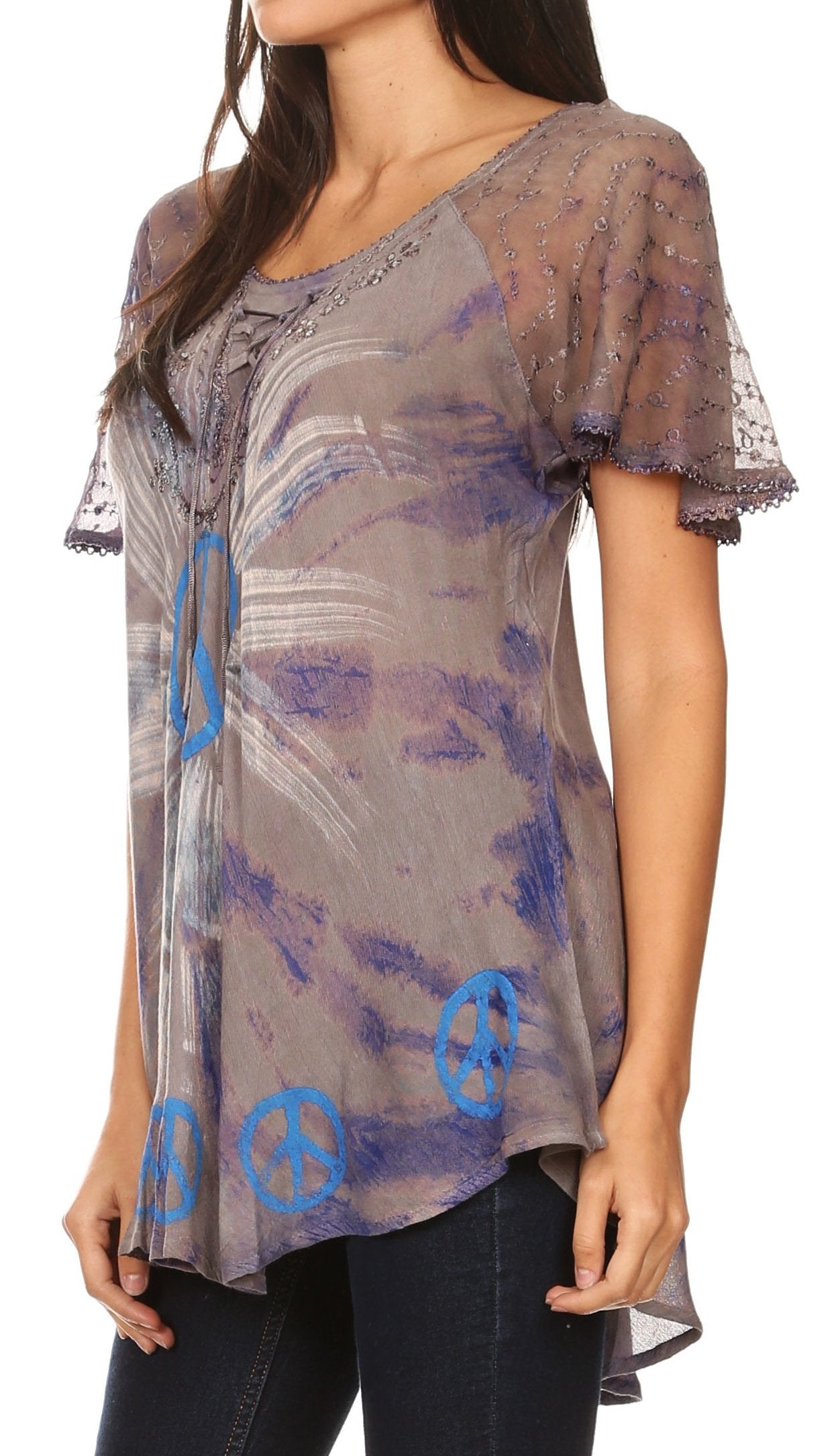 Woman wearing a sheer top with blue peace signs on a white background
