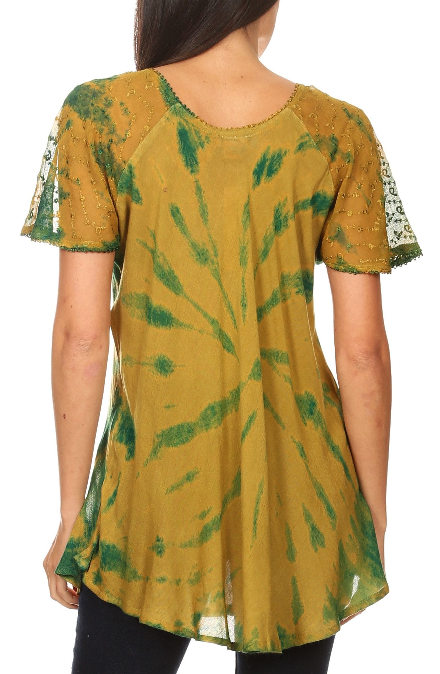 Woman wearing a mustard yellow and green tie-dye dress with lace sleeves on a white background