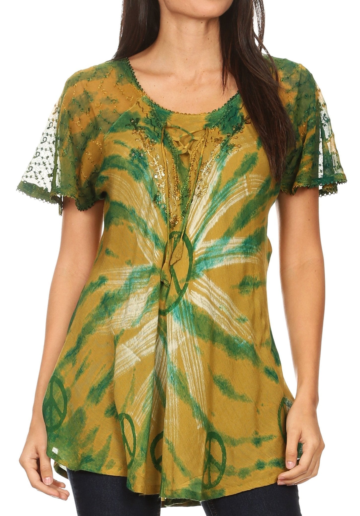 Woman wearing a green and yellow patterned top with lace sleeves.