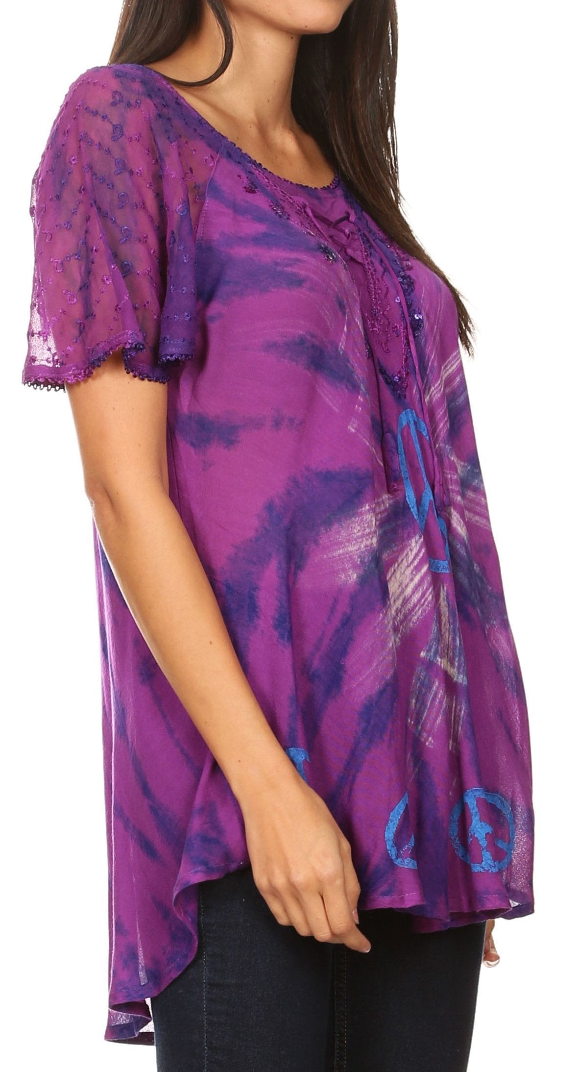 Purple patterned top worn by a person on a white background