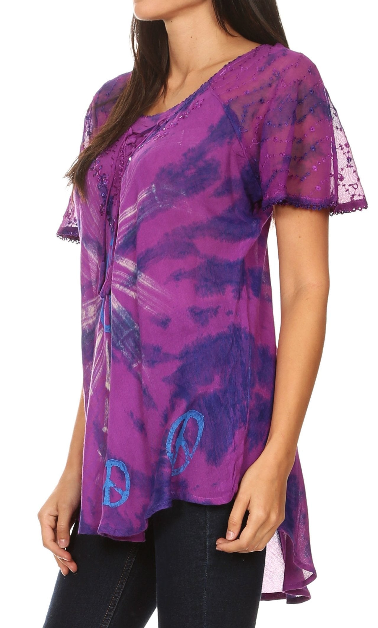 Woman wearing a purple tie-dye shirt with a peace symbol on a white background
